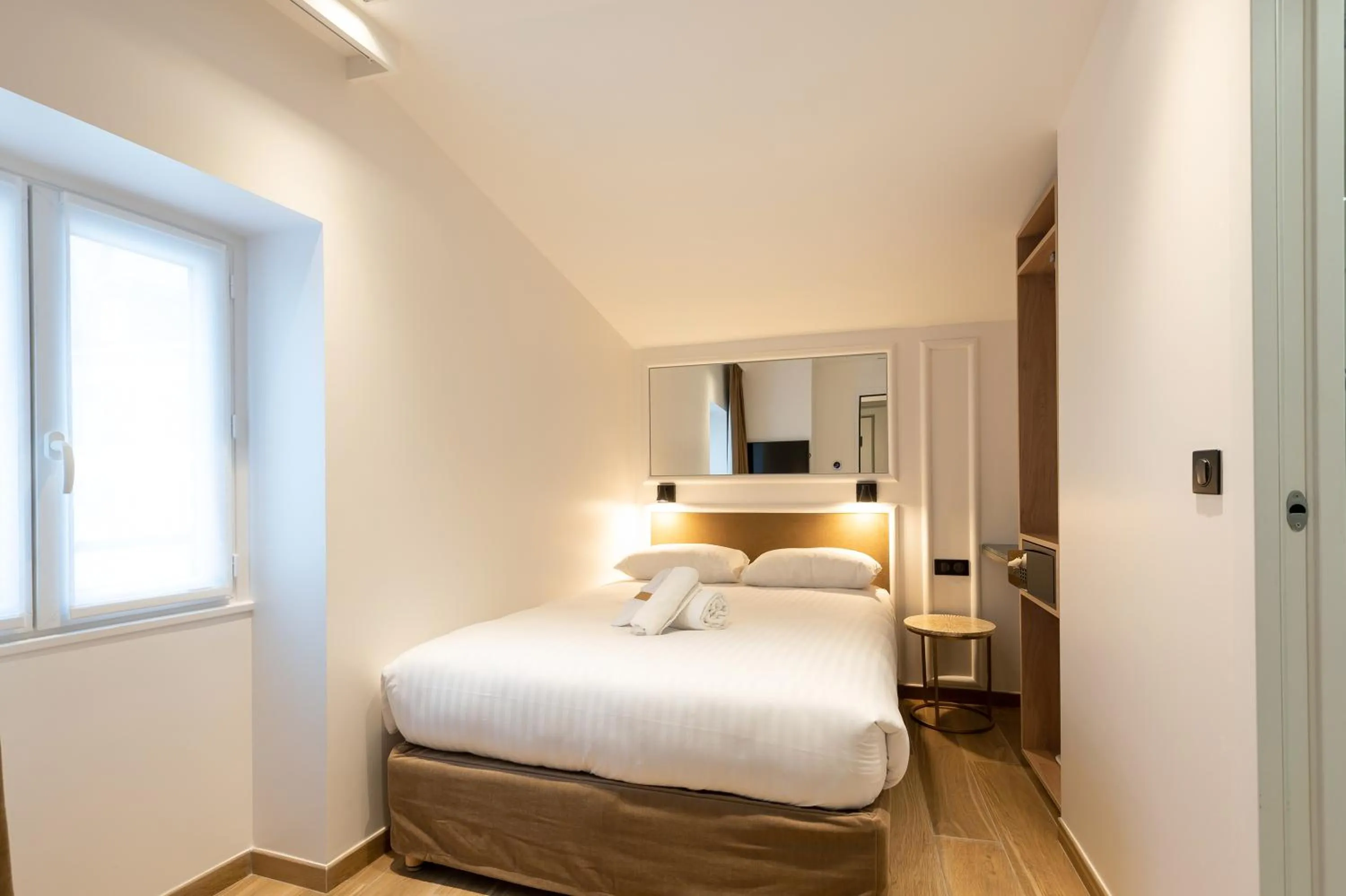 Photo of the whole room, Bed in HOTEL AU COEUR DE REPUBLIQUE