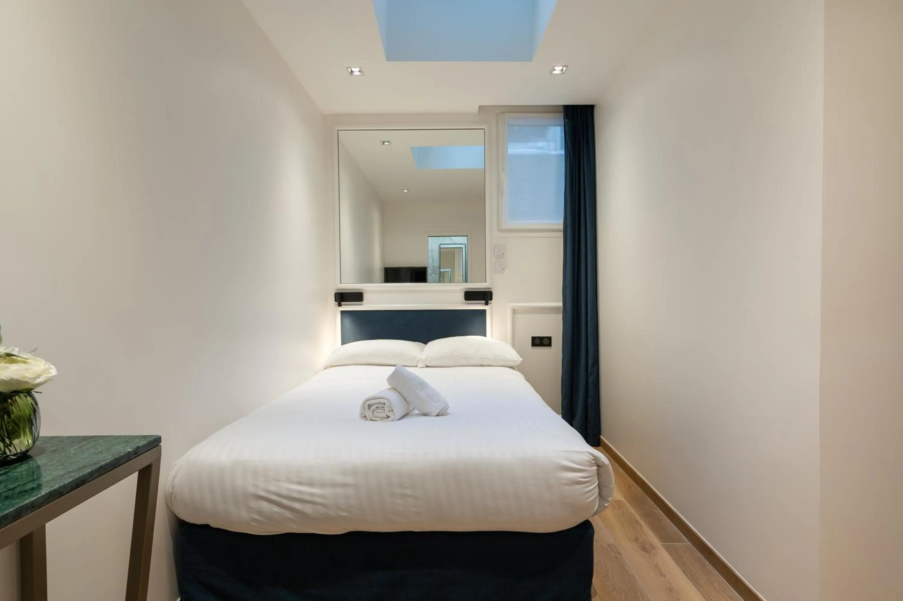 Bed in HOTEL AU COEUR DE REPUBLIQUE