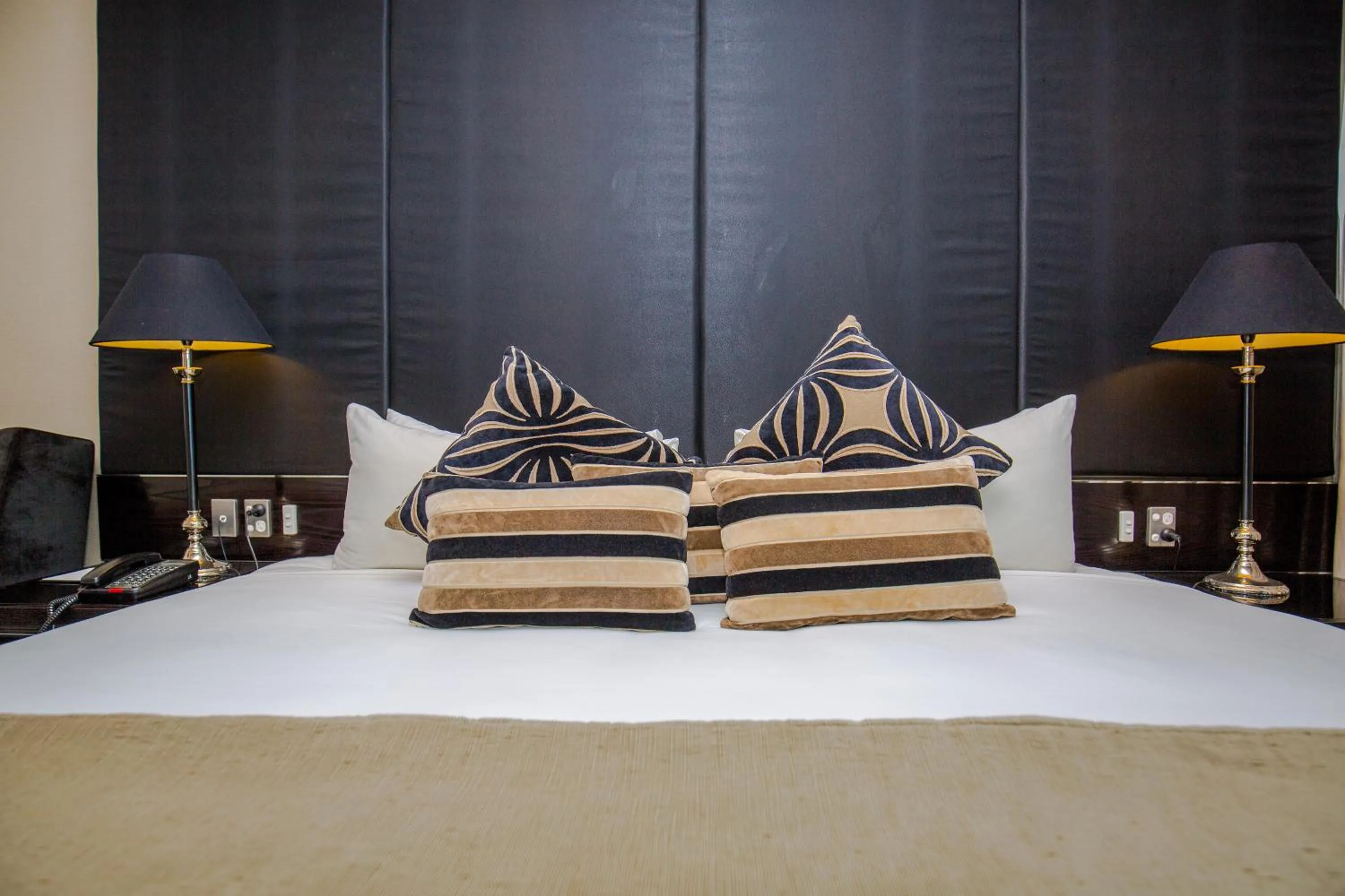 Bed in Grand Papua Hotel