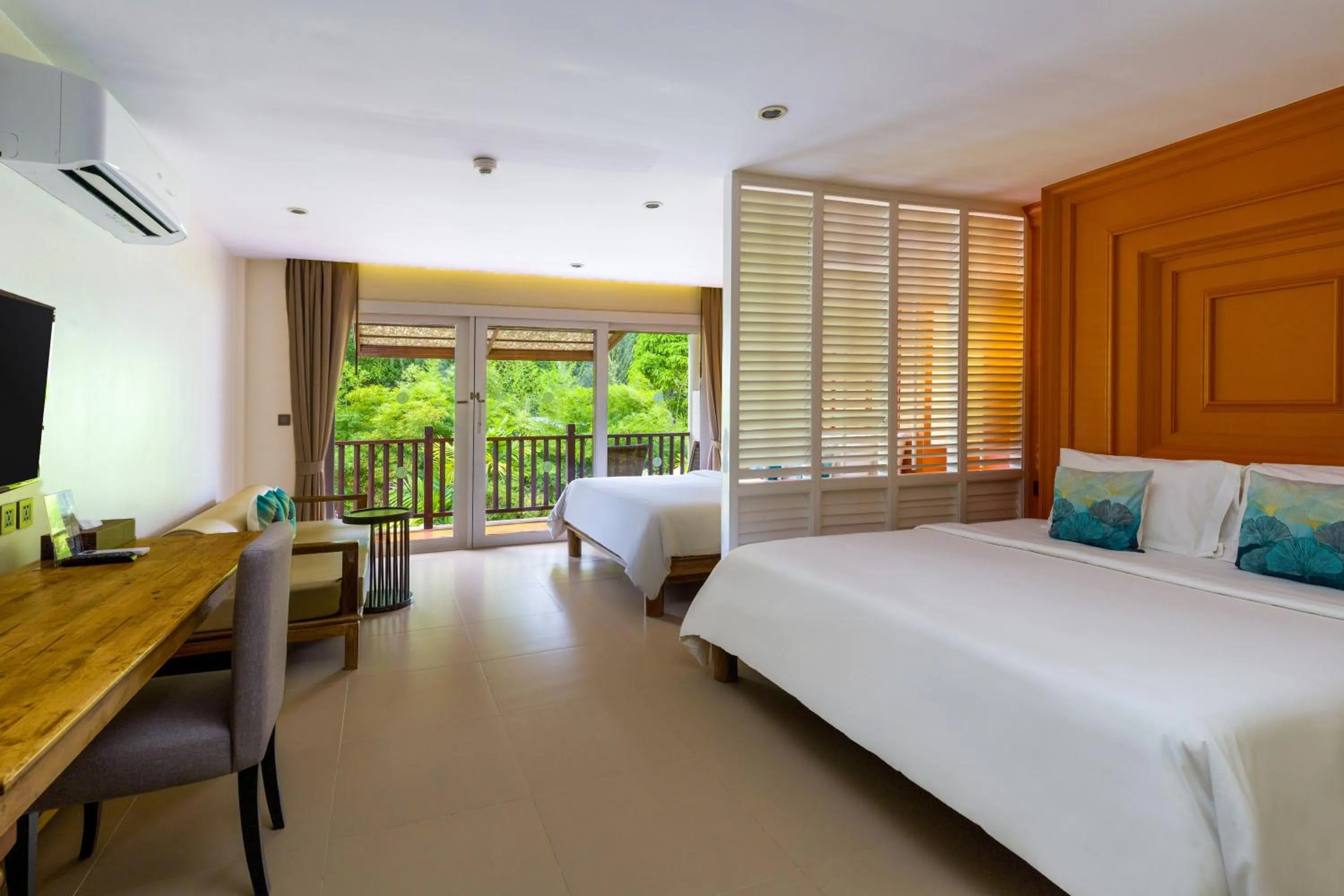 Bed in Arinara Beach Resort Phuket - SHA Extra Plus