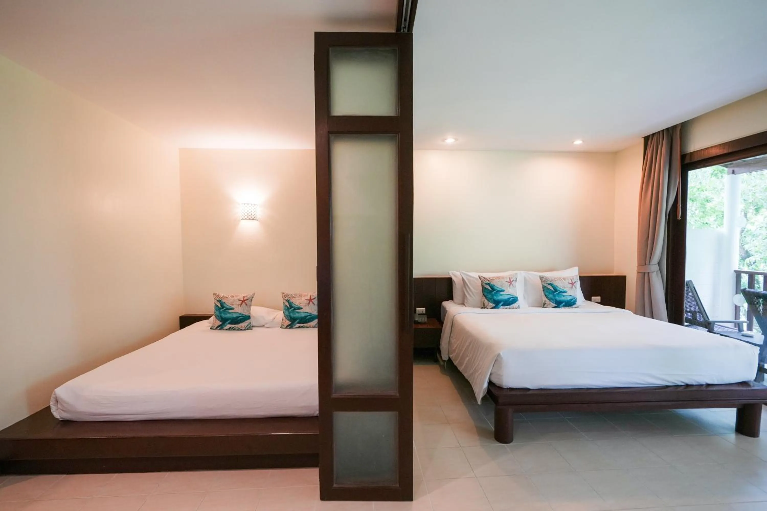Bed in Arinara Beach Resort Phuket - SHA Extra Plus