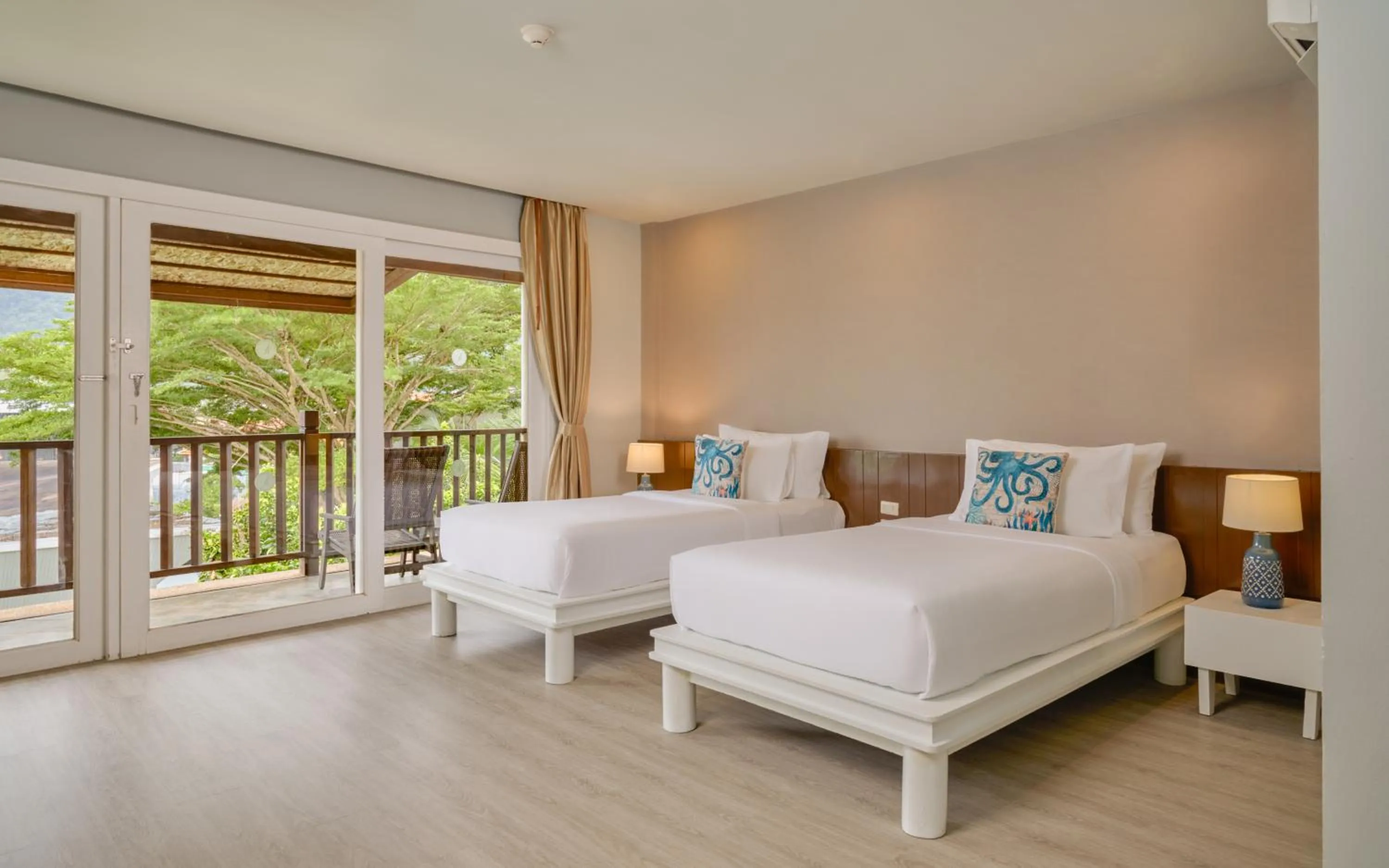 Bed in Arinara Beach Resort Phuket - SHA Extra Plus