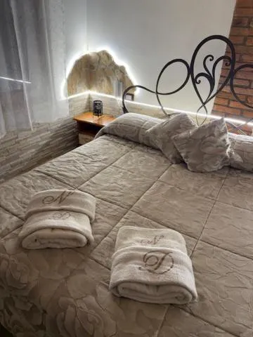 Bed in NICOLE DONEY LOCAZIONE TURISTICA