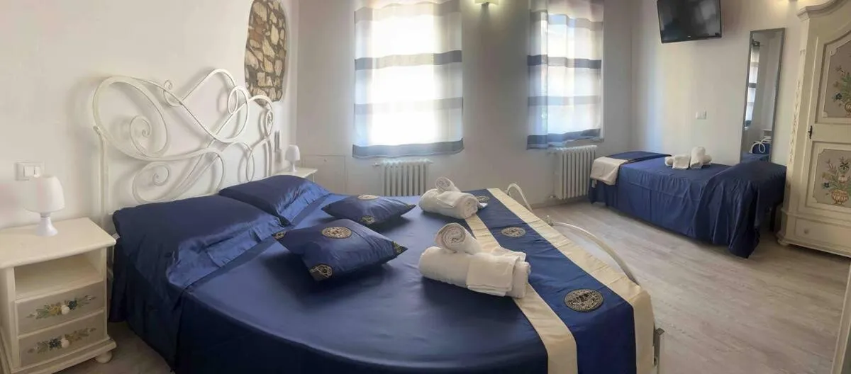 Bed in NICOLE DONEY LOCAZIONE TURISTICA