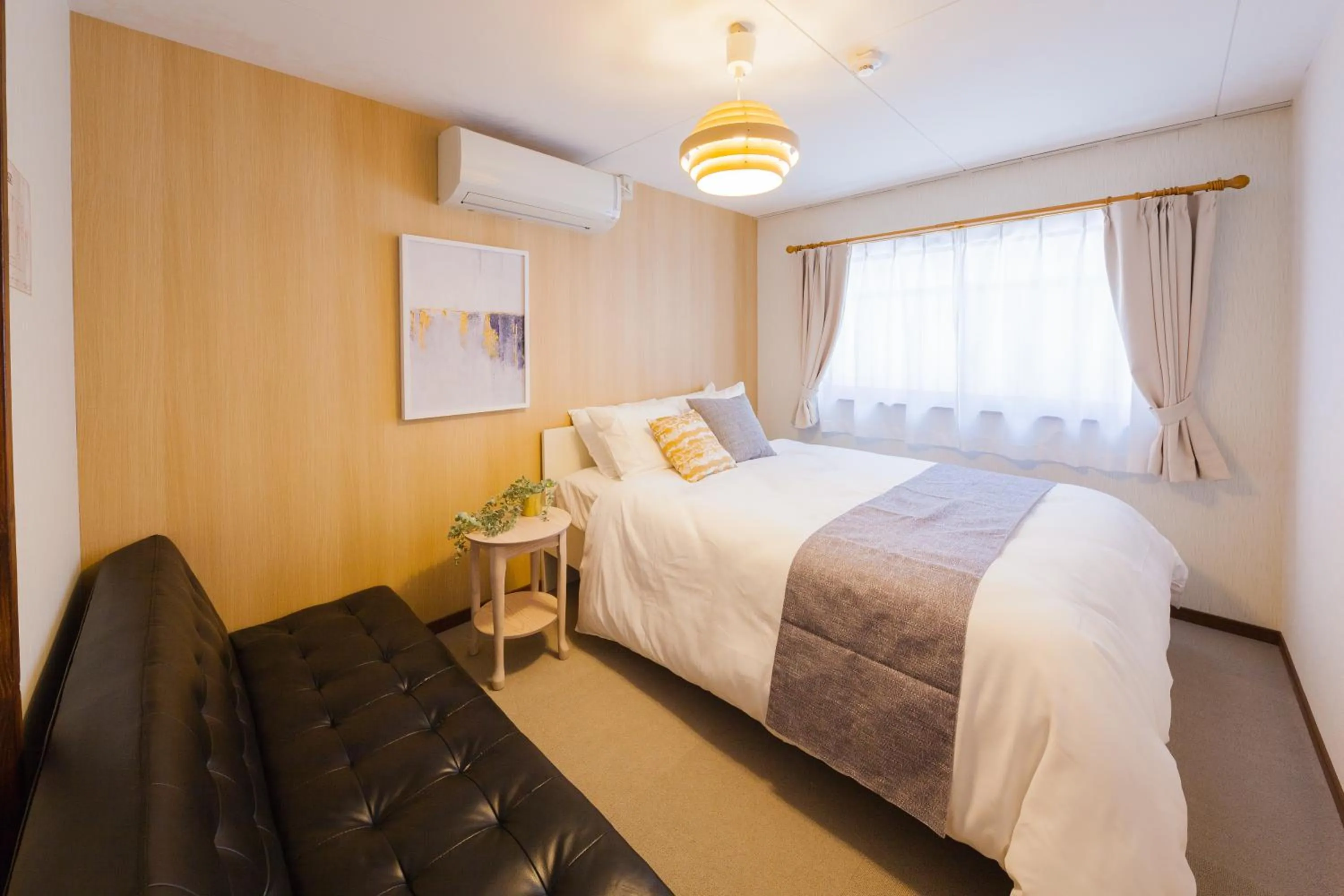 Bed in Prestige Suites Osaka Kishinosato-Tamade