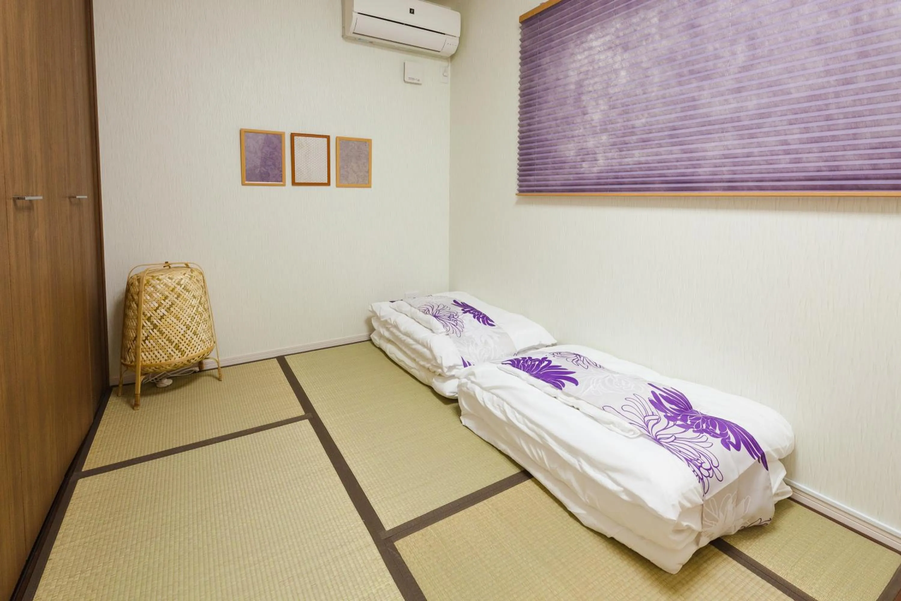 Bed in Prestige Suites Osaka Kishinosato-Tamade