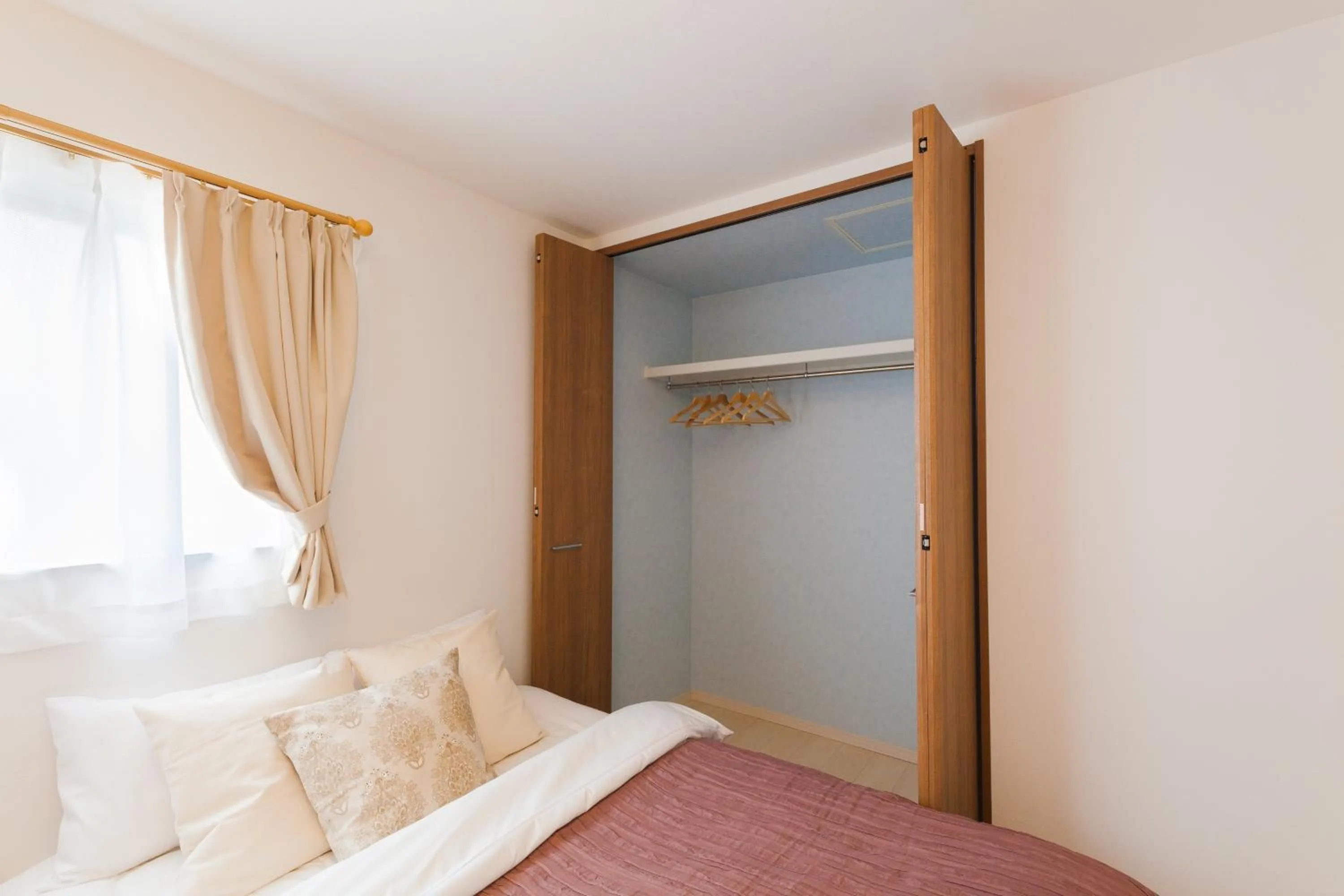 Bed in Prestige Suites Osaka Kishinosato-Tamade