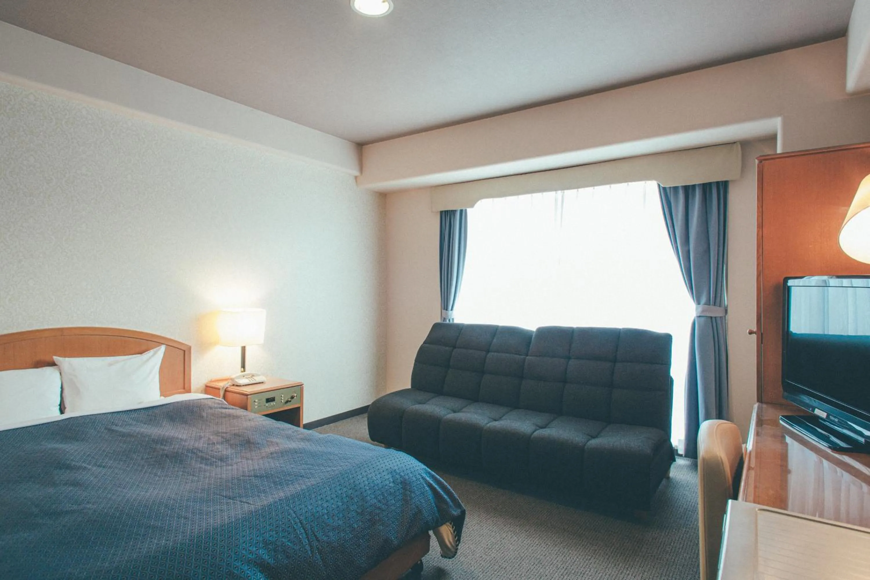 Bed in Hotel Villa Kuretake