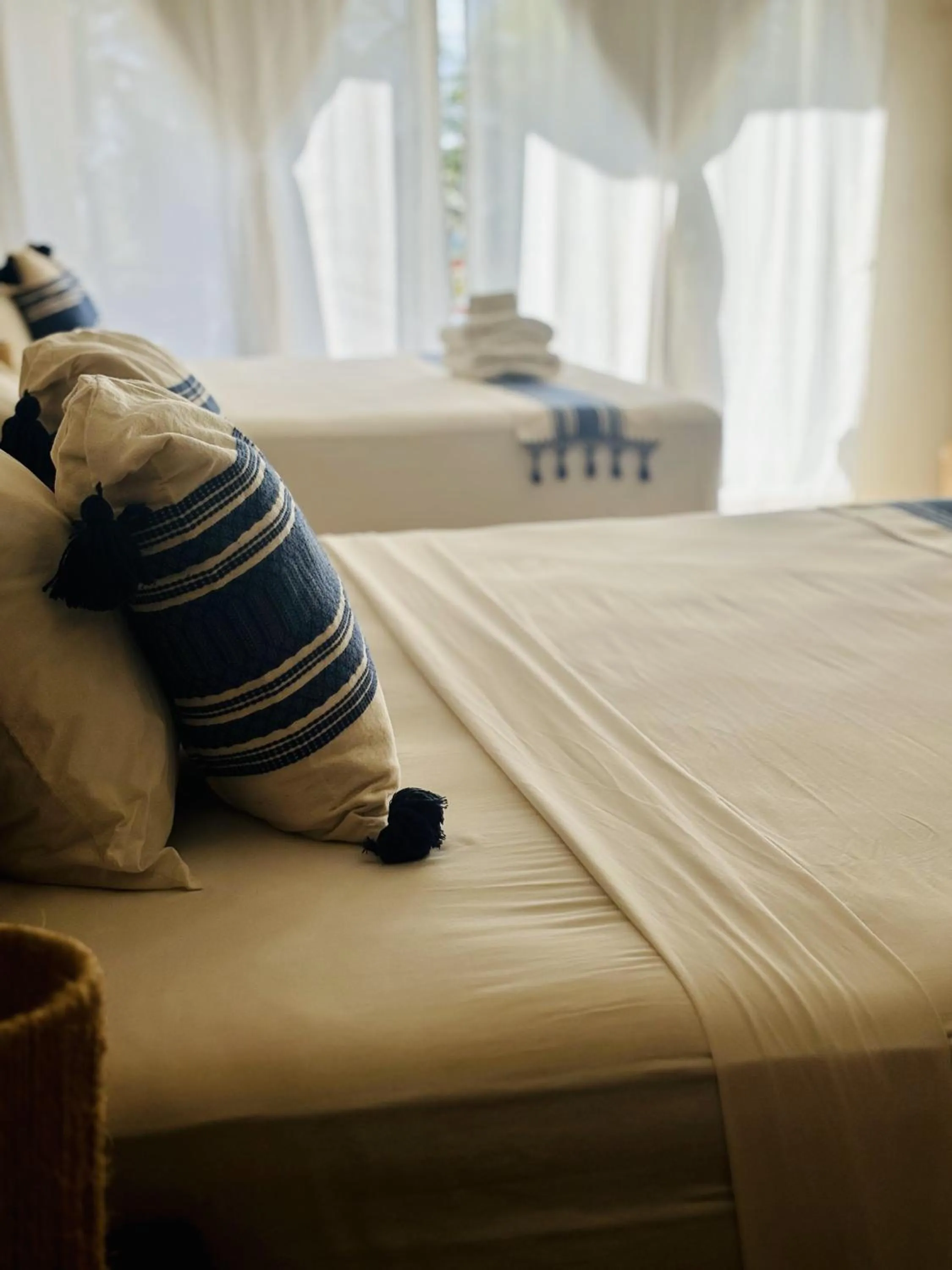 Bed in Noah Beach Hotel & Suites