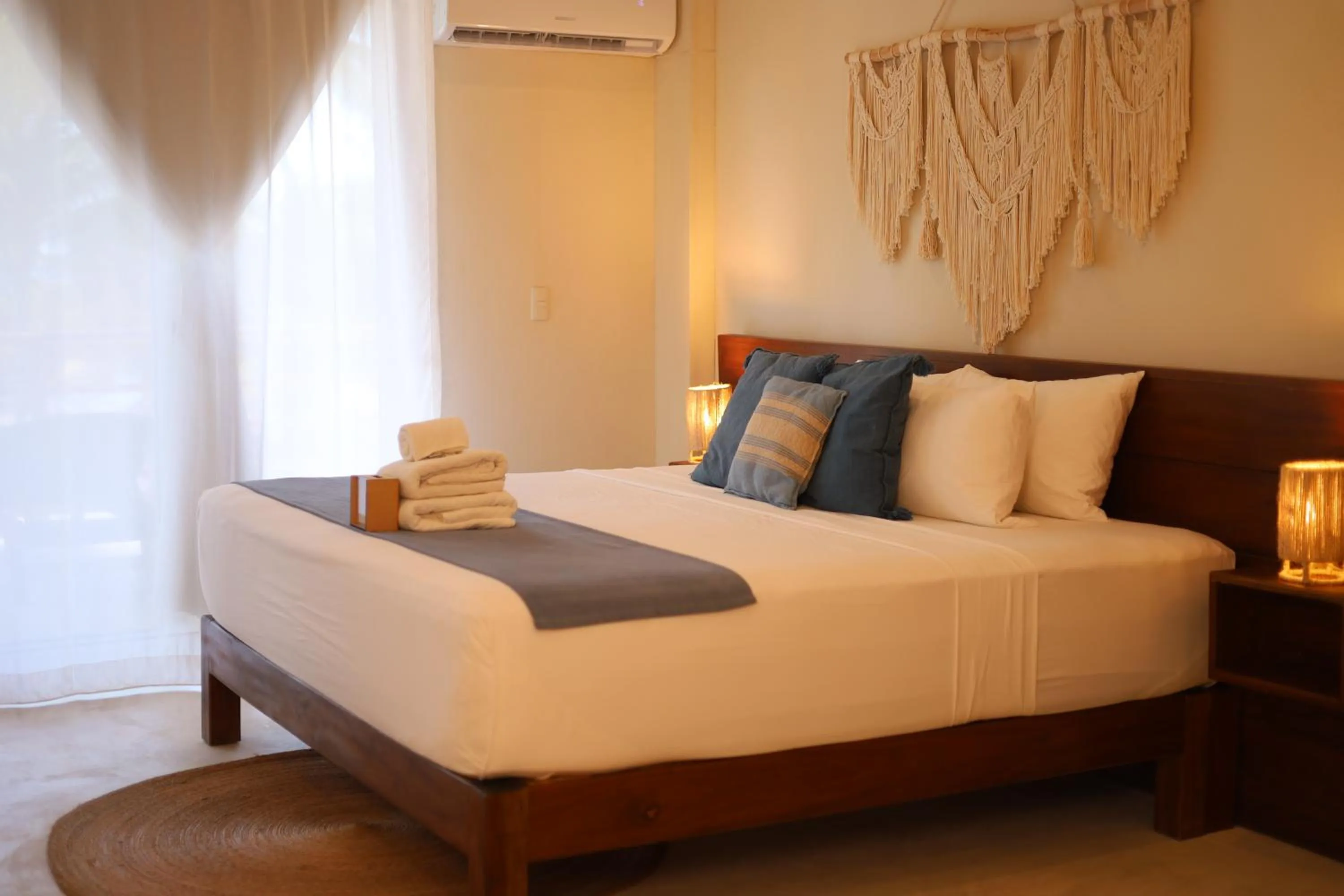 Bed in Noah Beach Hotel & Suites