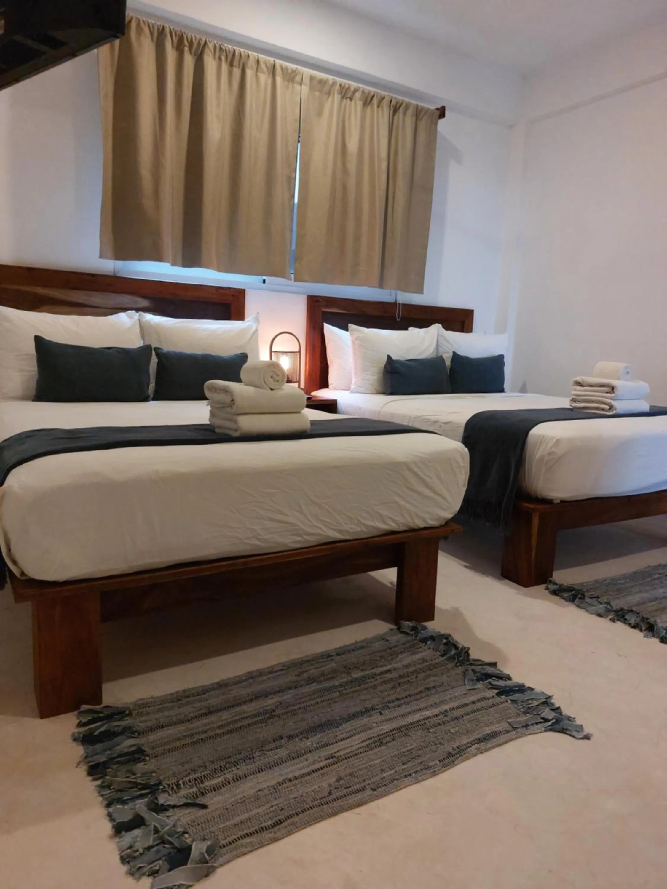Bed in Noah Beach Hotel & Suites