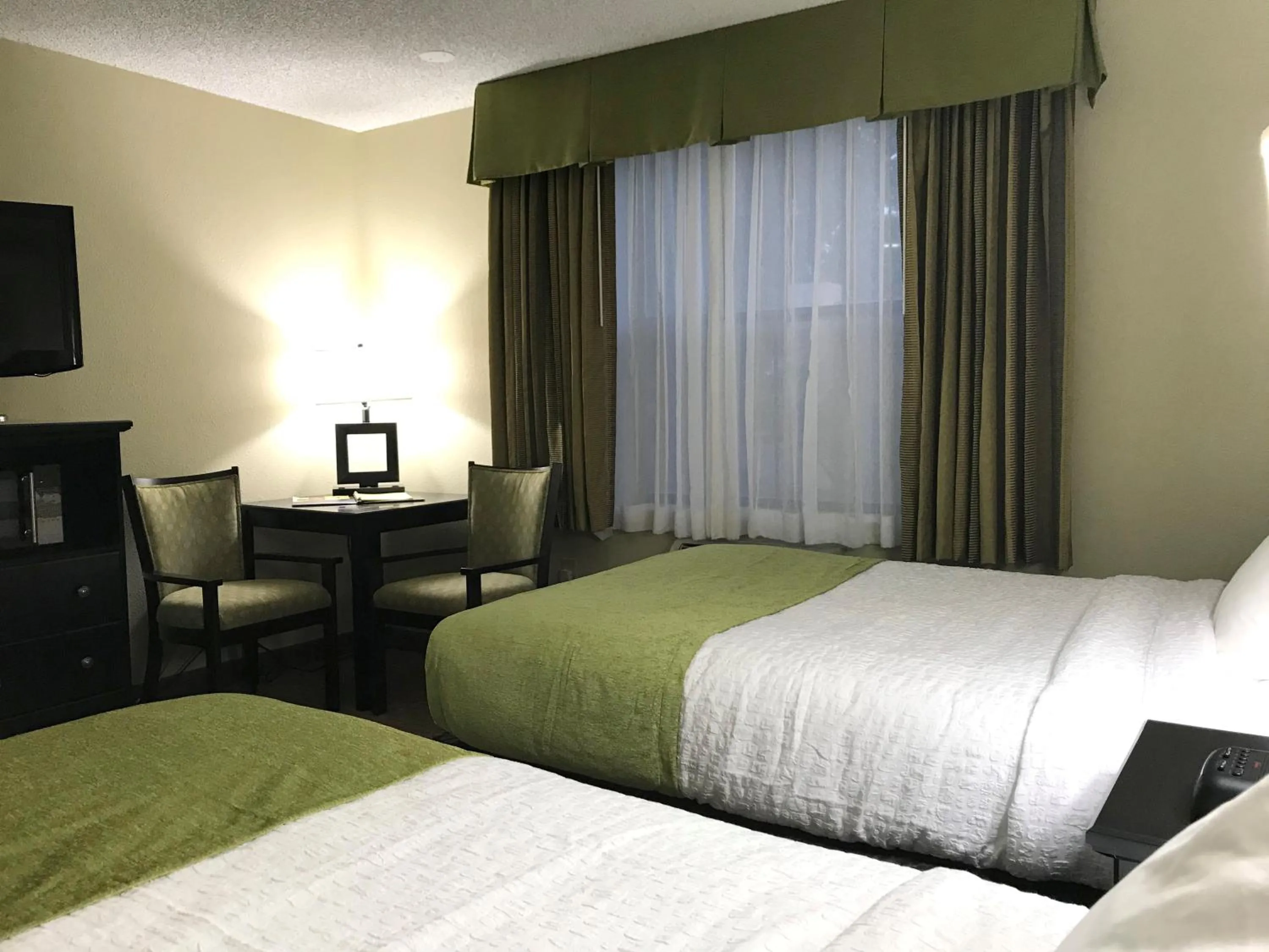 Seating area, Bed in NavajoLand Hotel