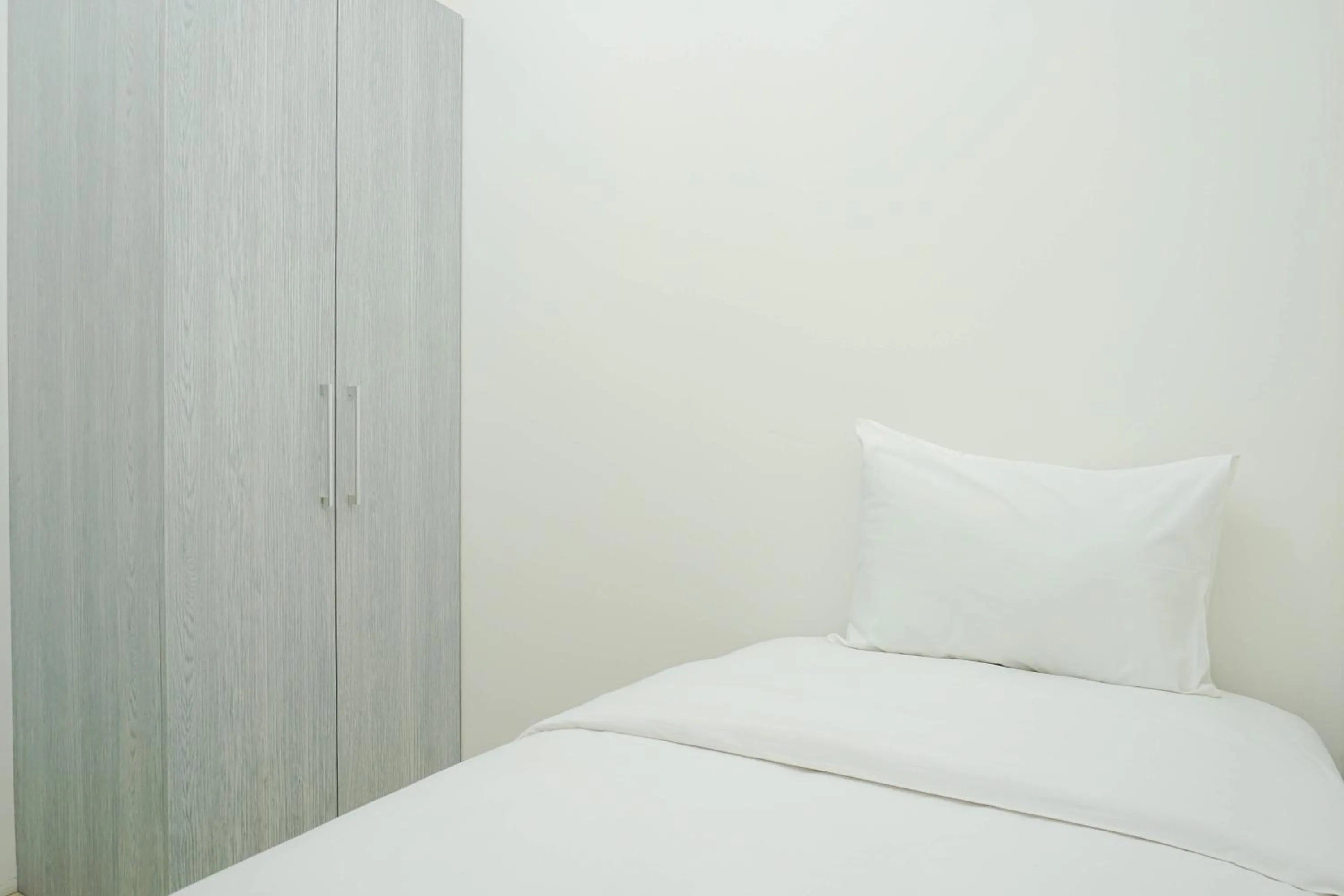 Bed in Cozy with River View @ 2BR Teluk Intan Apartment By Travelio