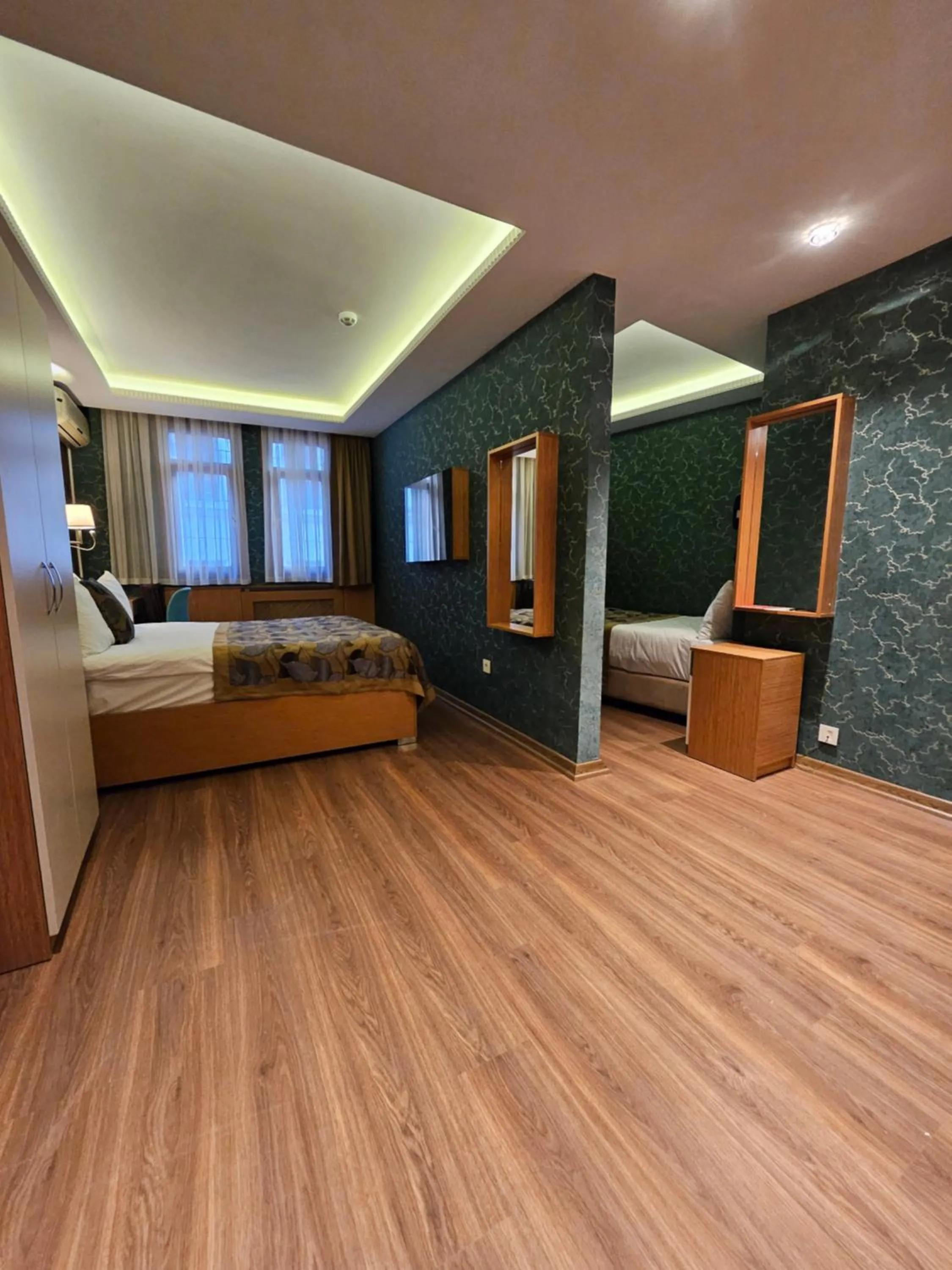 Kitchen or kitchenette, Bed in The Hotel Devman