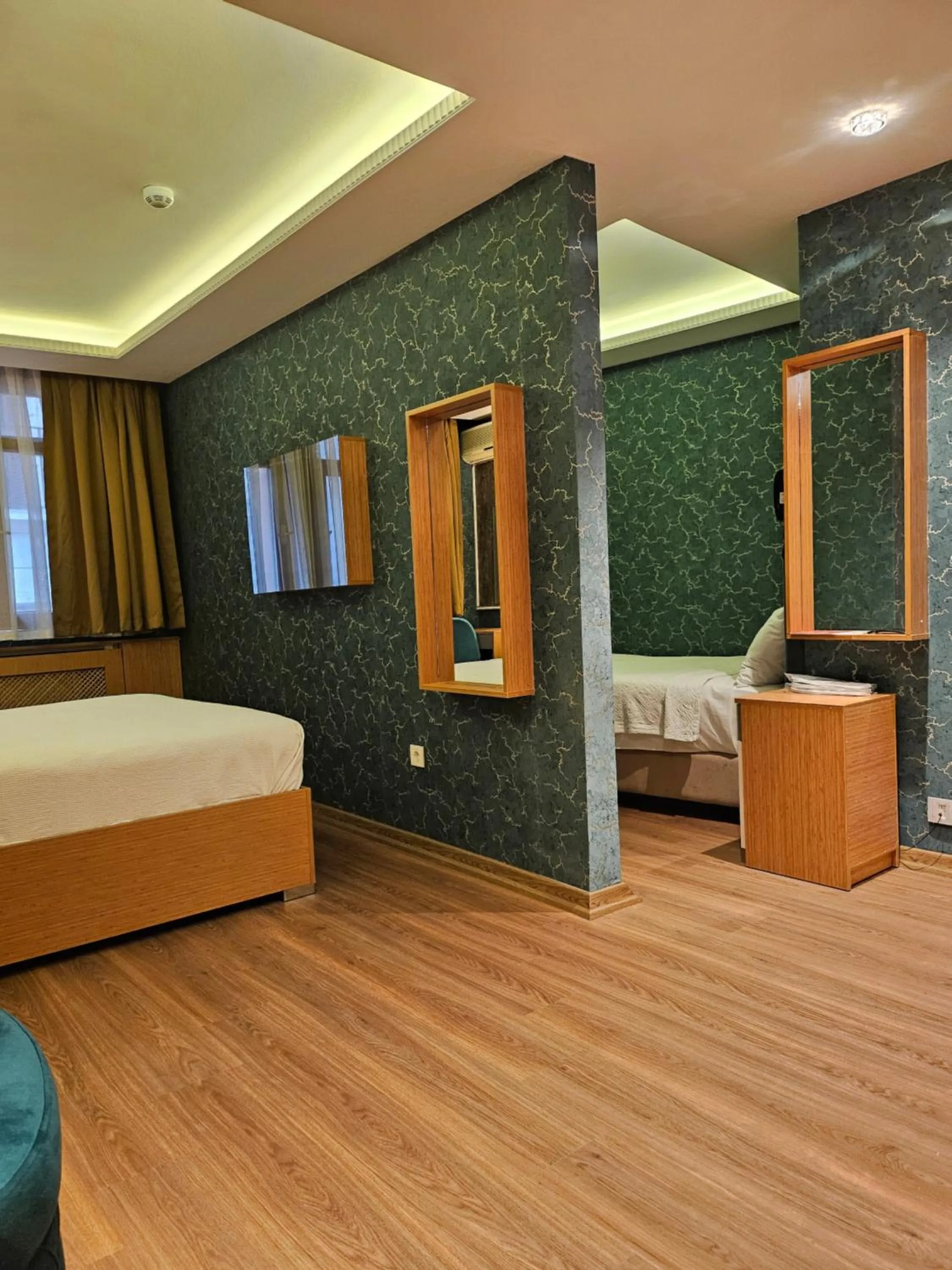 Kitchen or kitchenette, Bed in The Hotel Devman