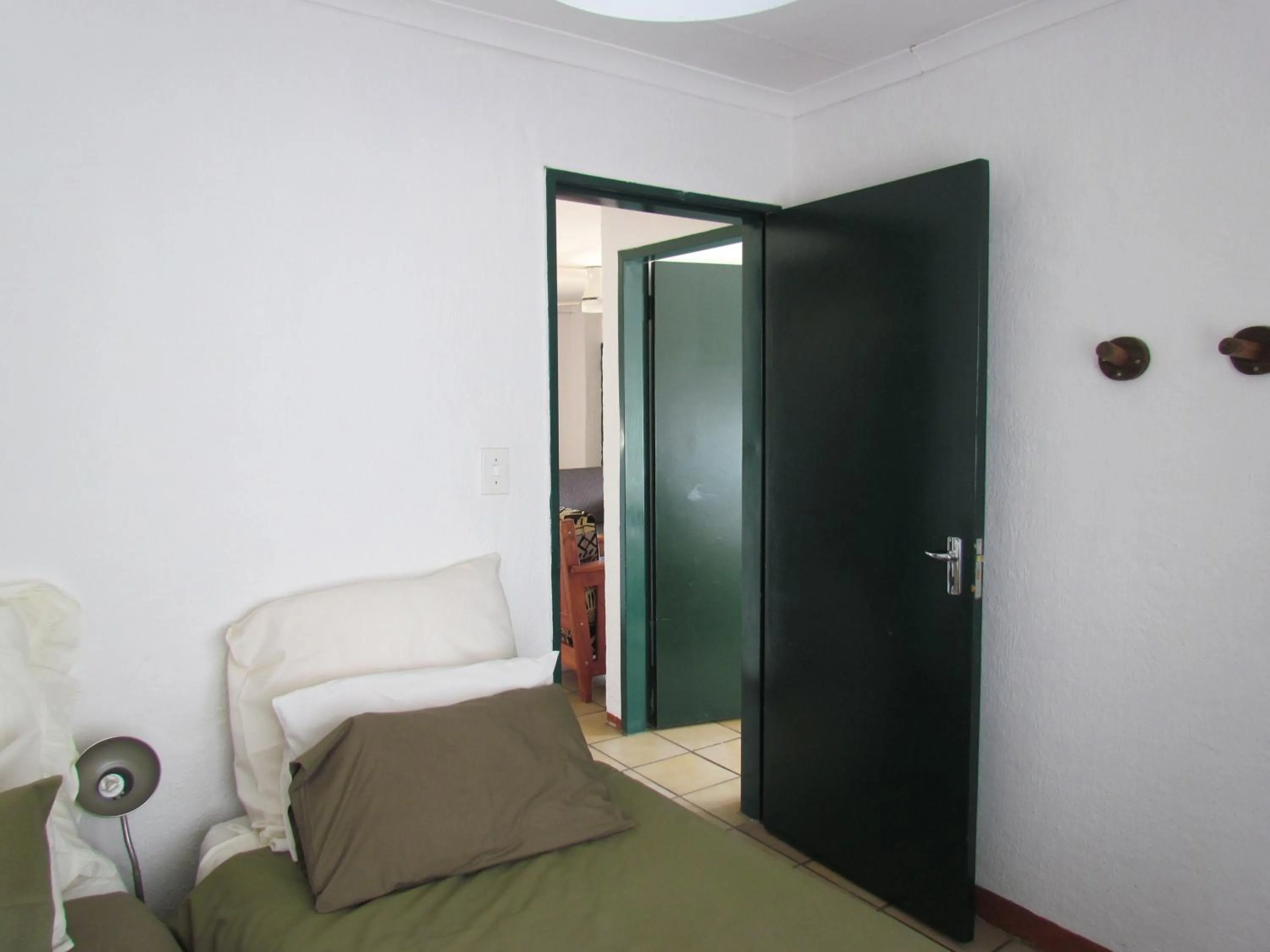 Seating area, Bed in Pumula Guest Farm