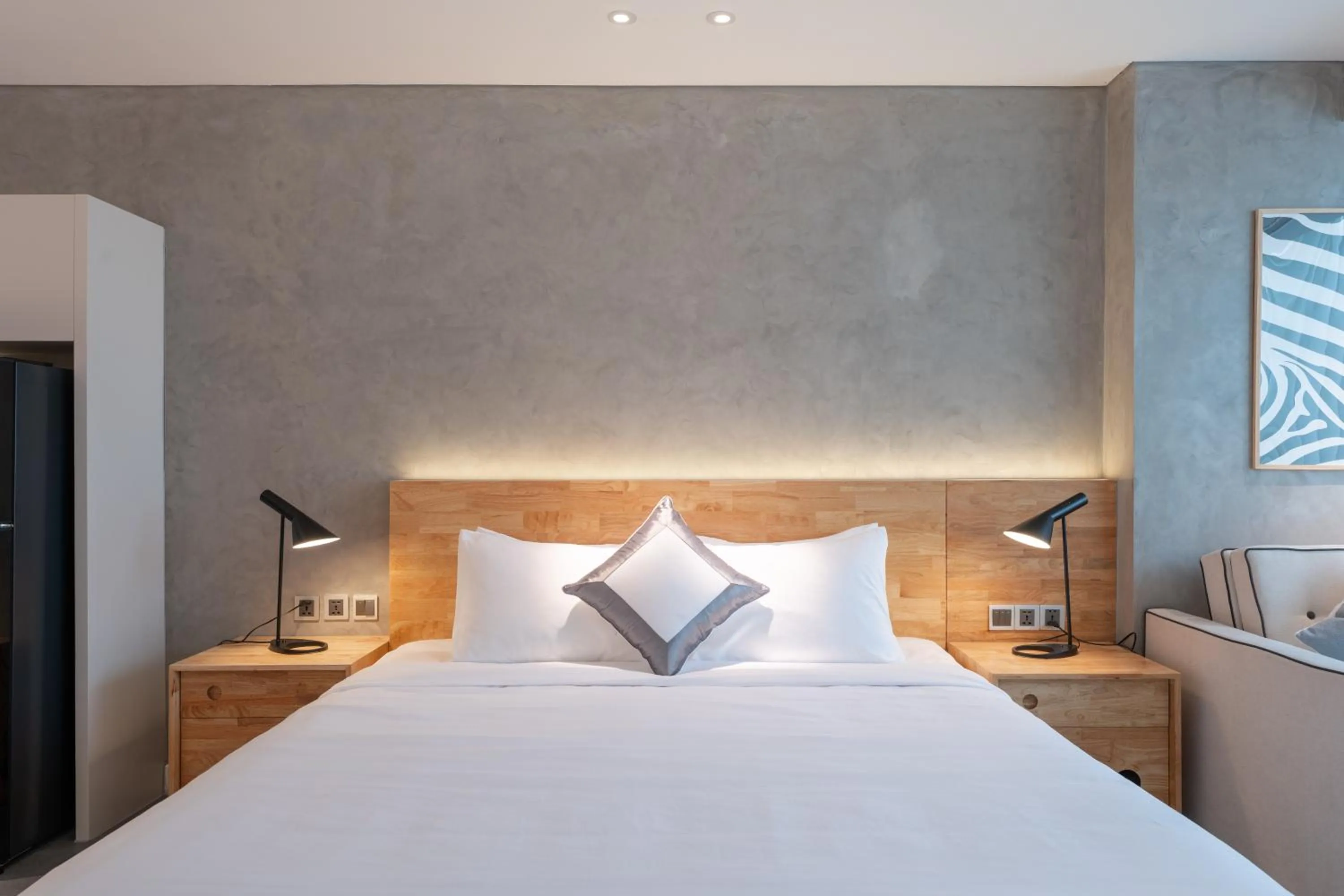 Bed in Bi Eco Suites Hanoi