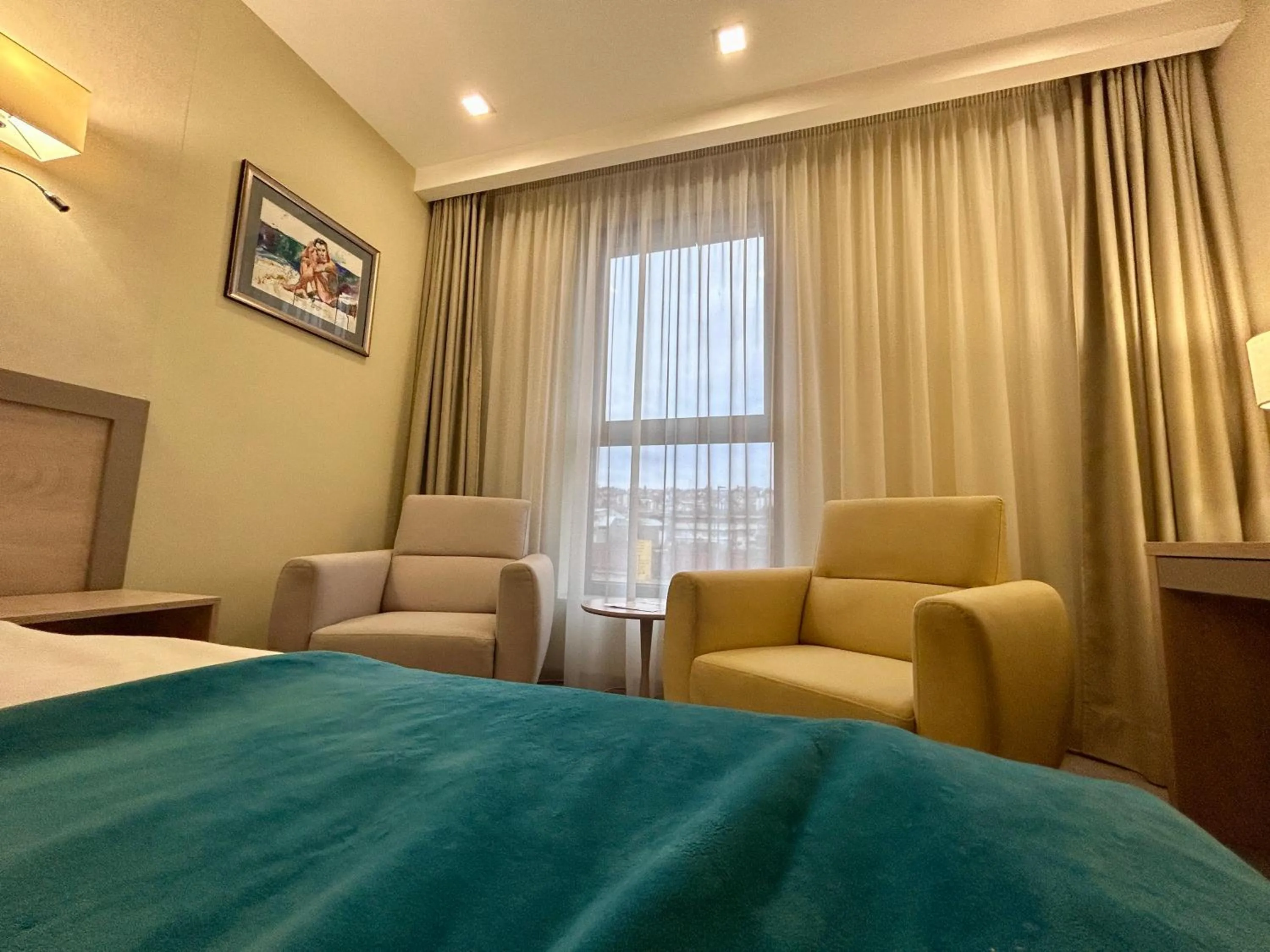 Living room, Bed in Hotel Siesta