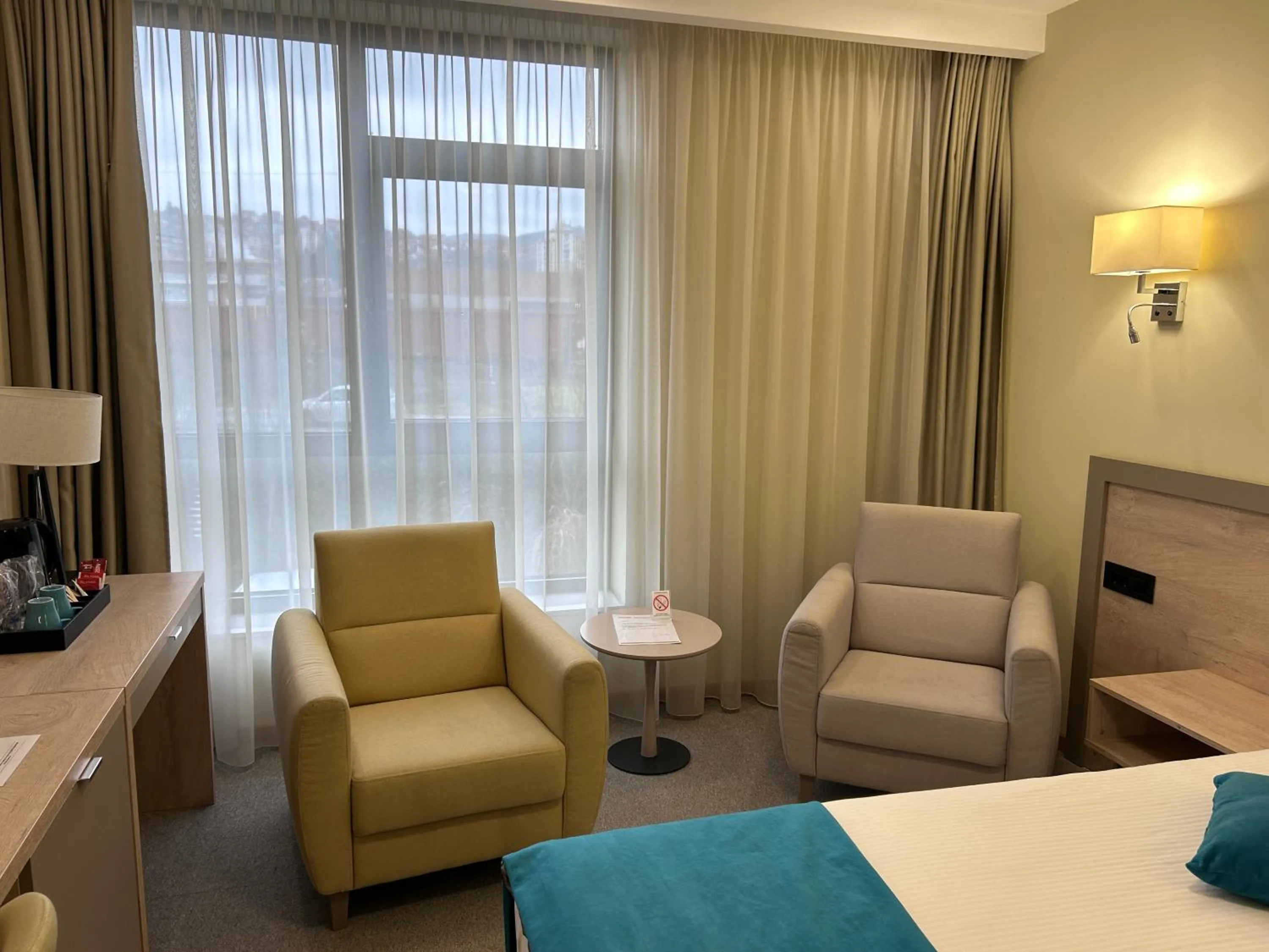 Living room, Bed in Hotel Siesta