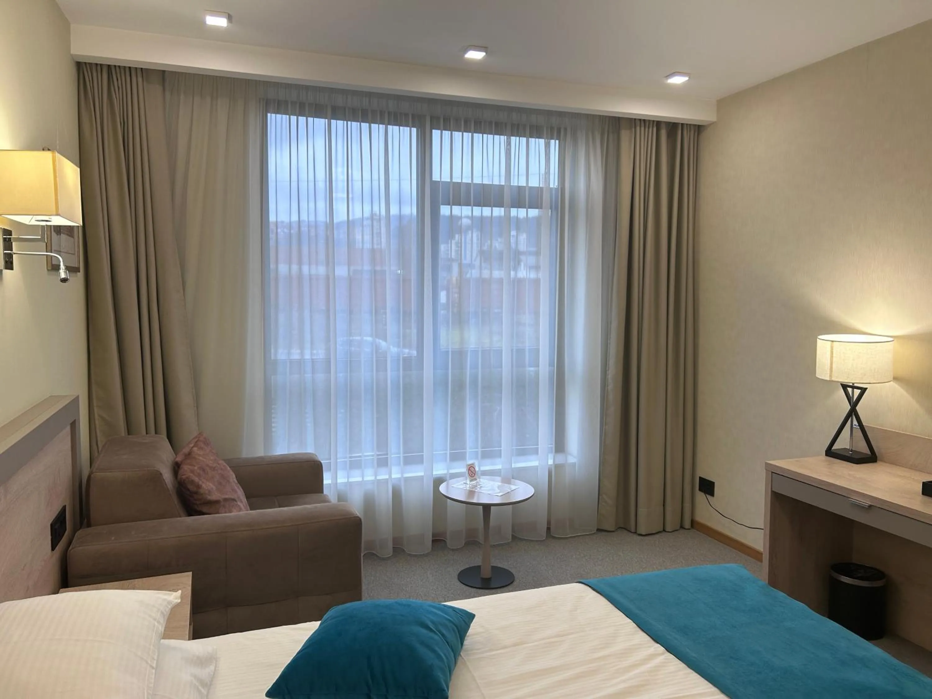 Living room, Bed in Hotel Siesta