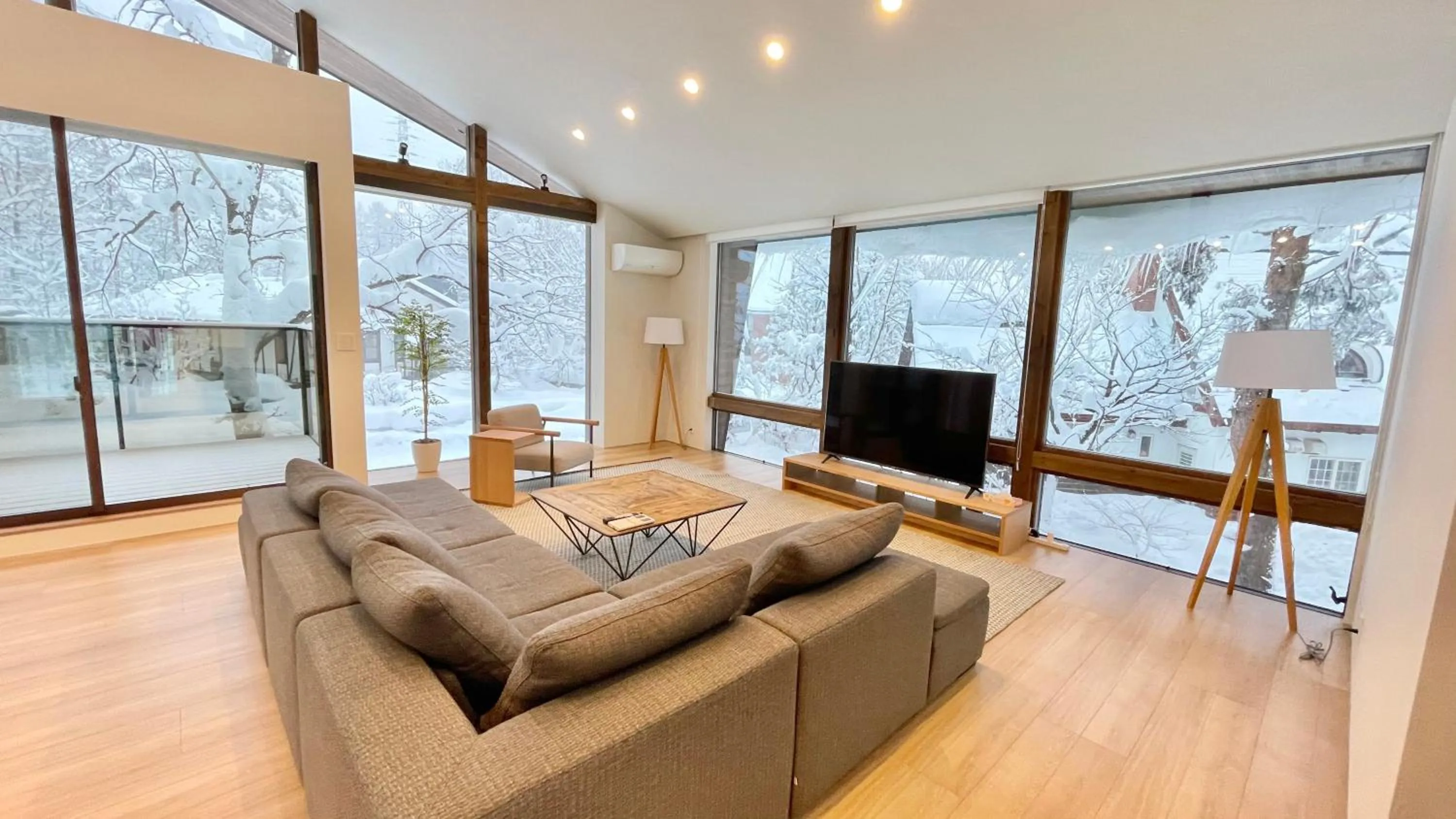 Living room in Ahiru Chalet by Hakuba White Fox Company