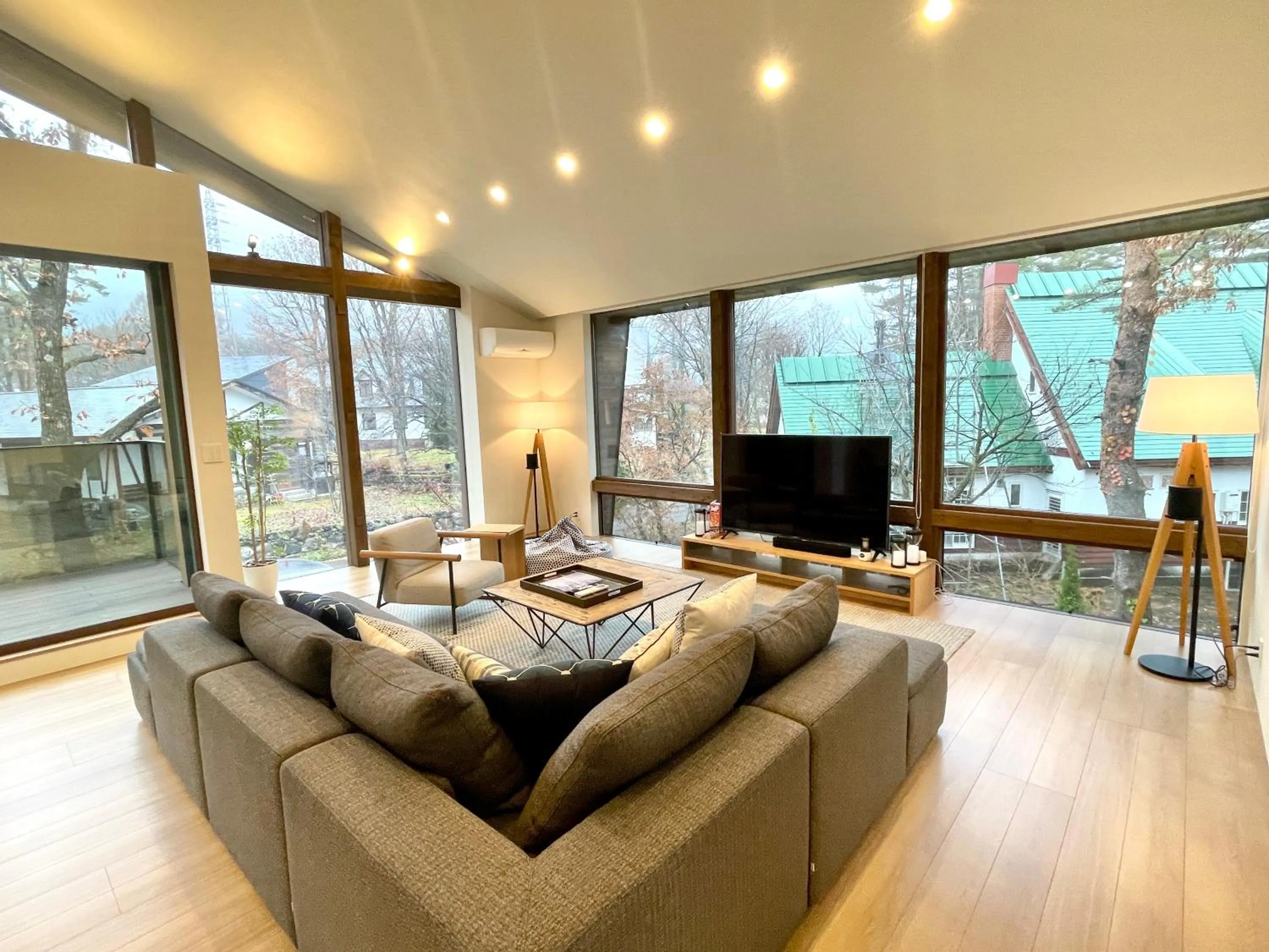 Living room in Ahiru Chalet by Hakuba White Fox Company