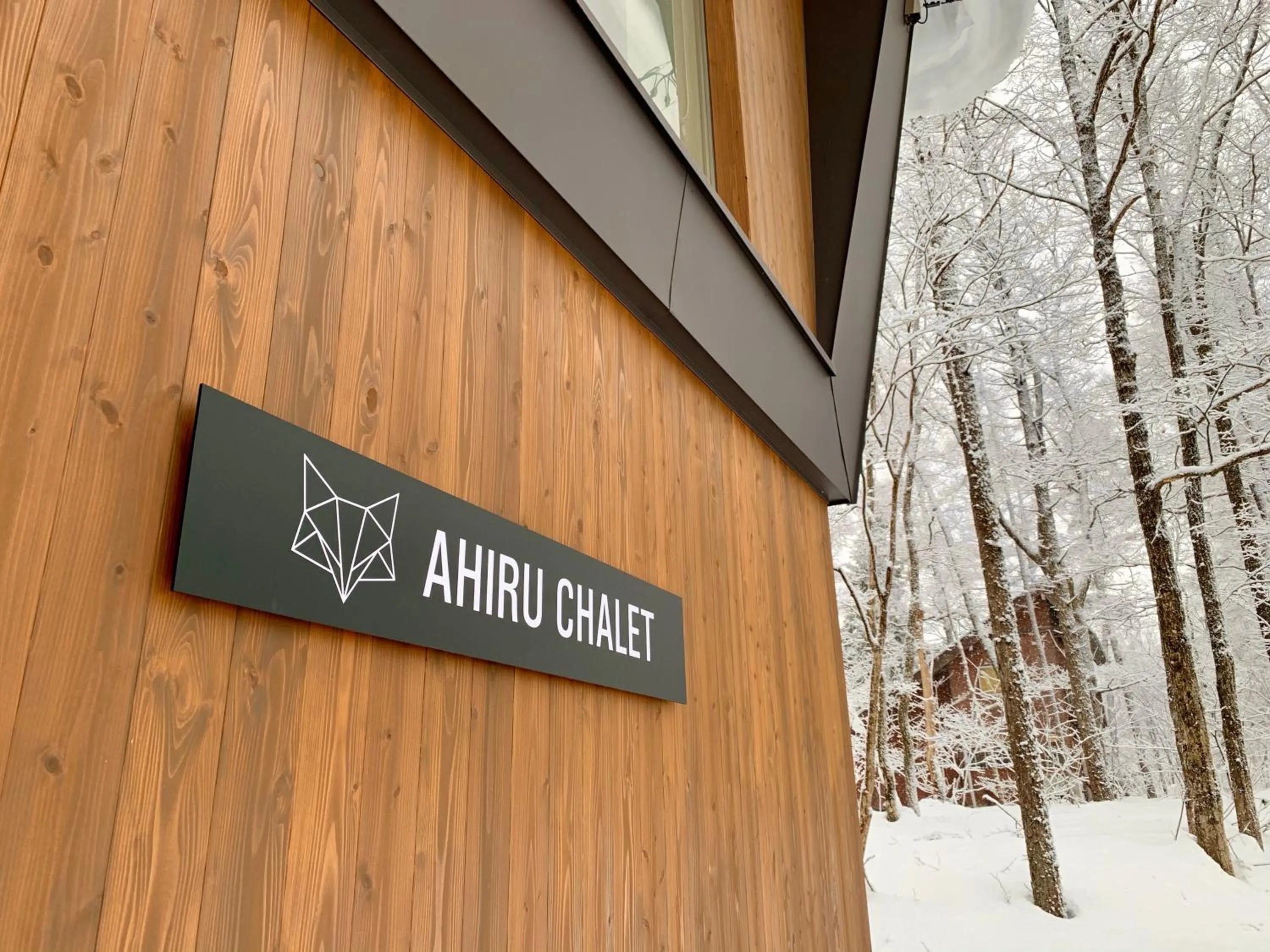 Property logo or sign in Ahiru Chalet by Hakuba White Fox Company