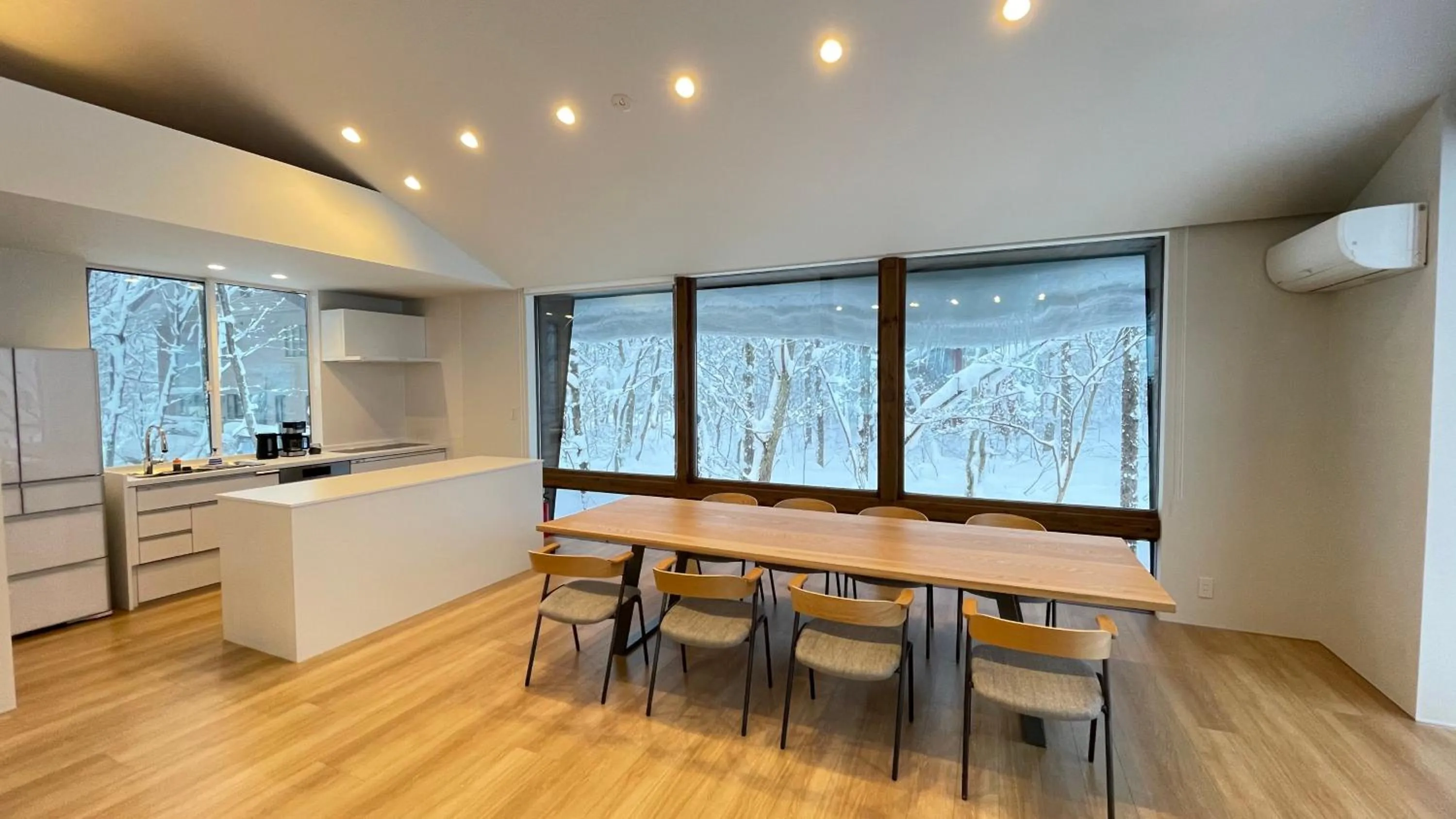 Dining area in Ahiru Chalet by Hakuba White Fox Company