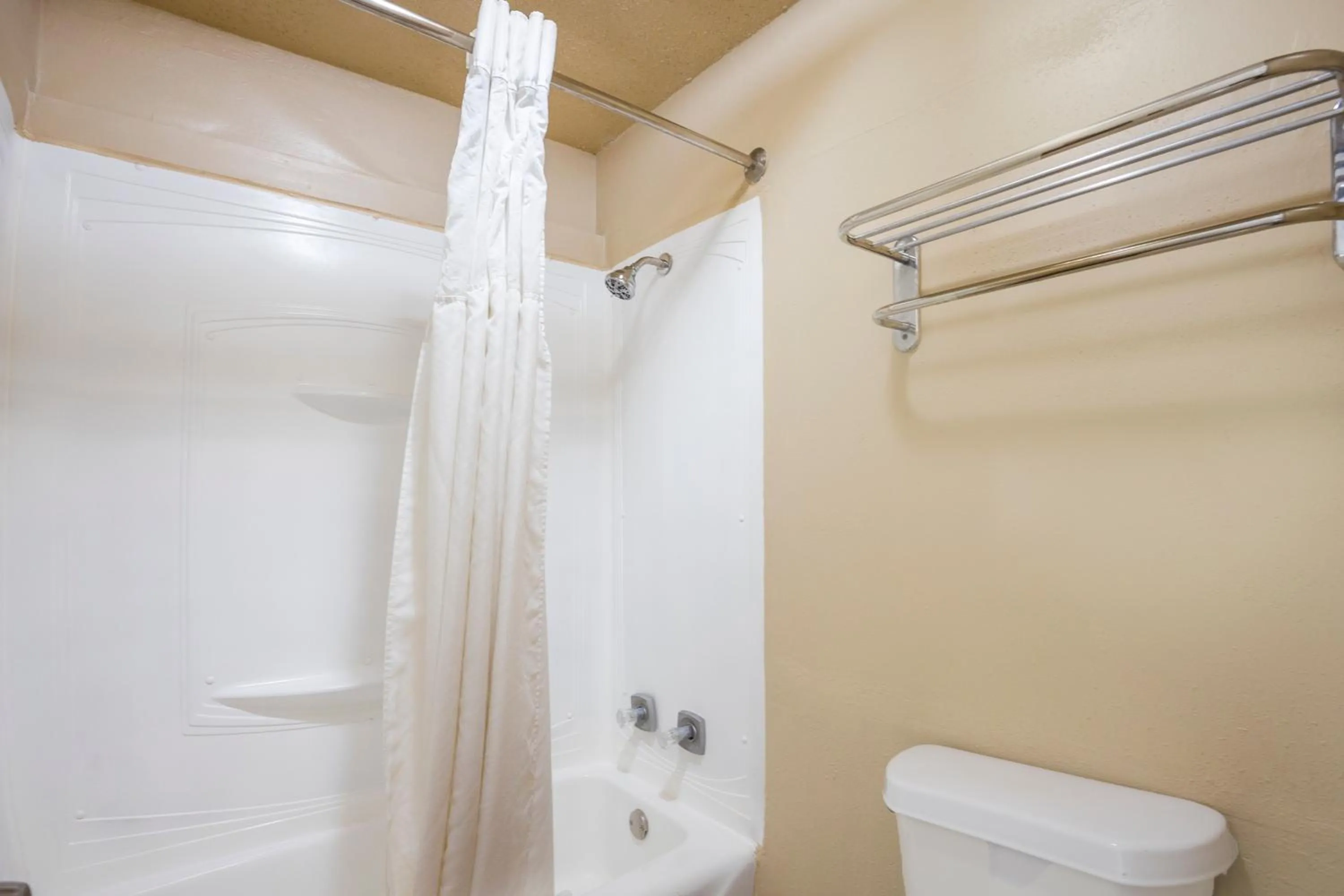 Bathroom in Liberty Garden Inn by OYO Kissimmee near Disney World