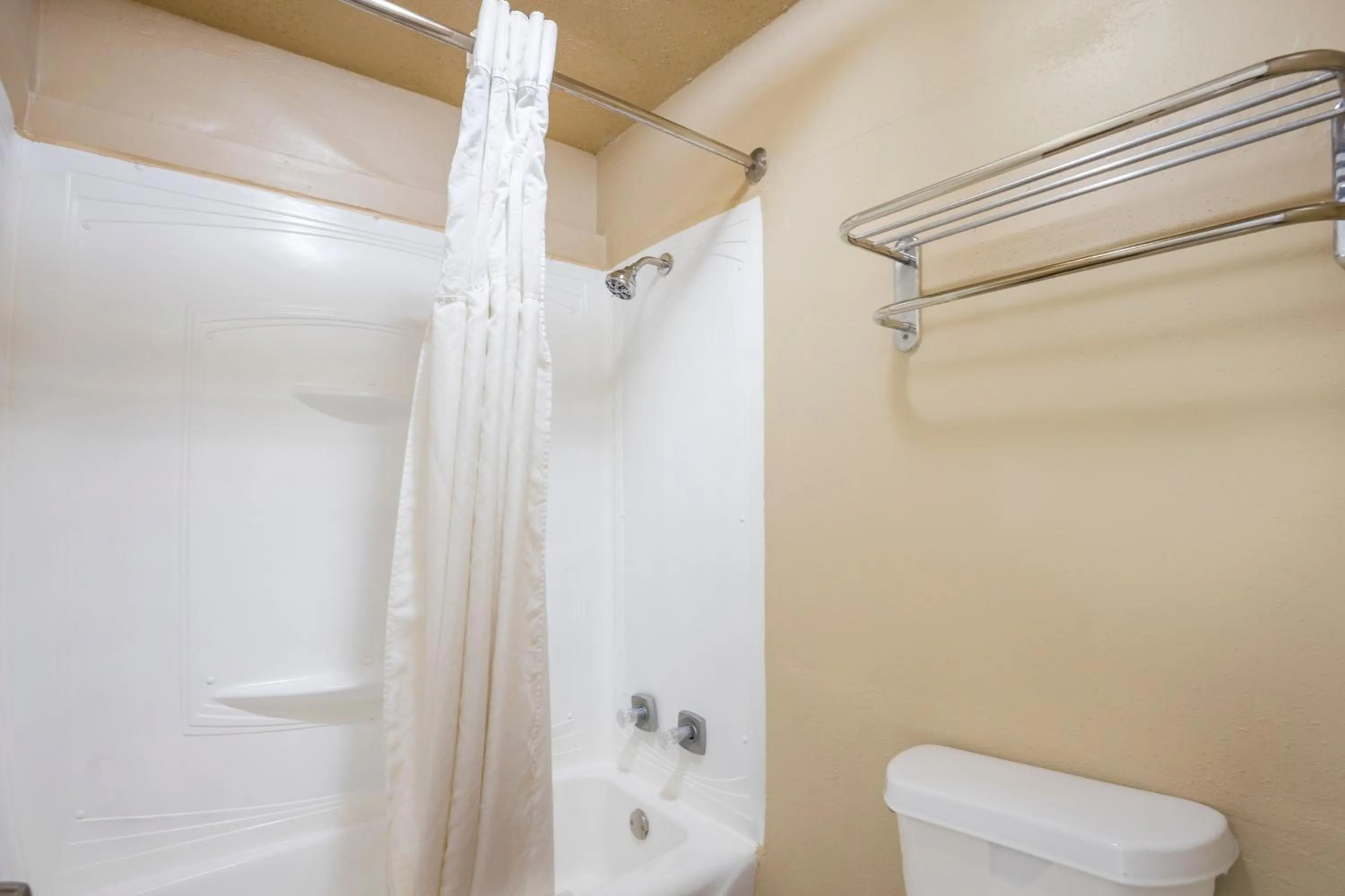 Bathroom in Liberty Garden Inn by OYO Kissimmee near Disney World