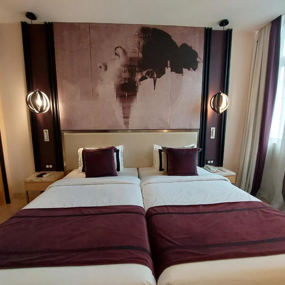 Bed in BEYZAA HOTEL AND SUITES