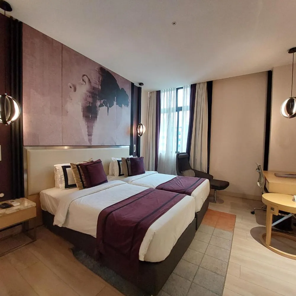 Bed in BEYZAA HOTEL AND SUITES