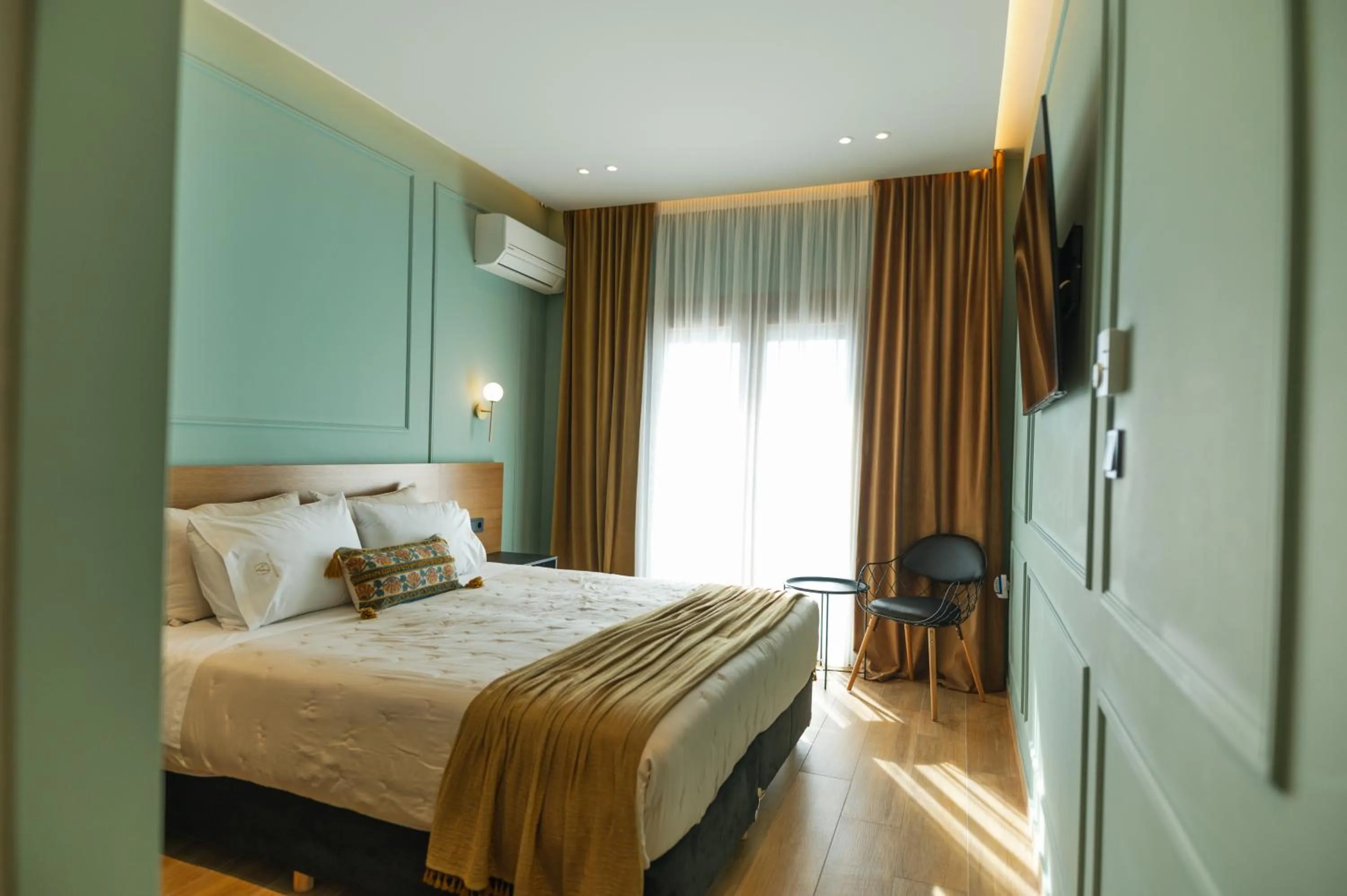 Bed in Aggelos Hotel