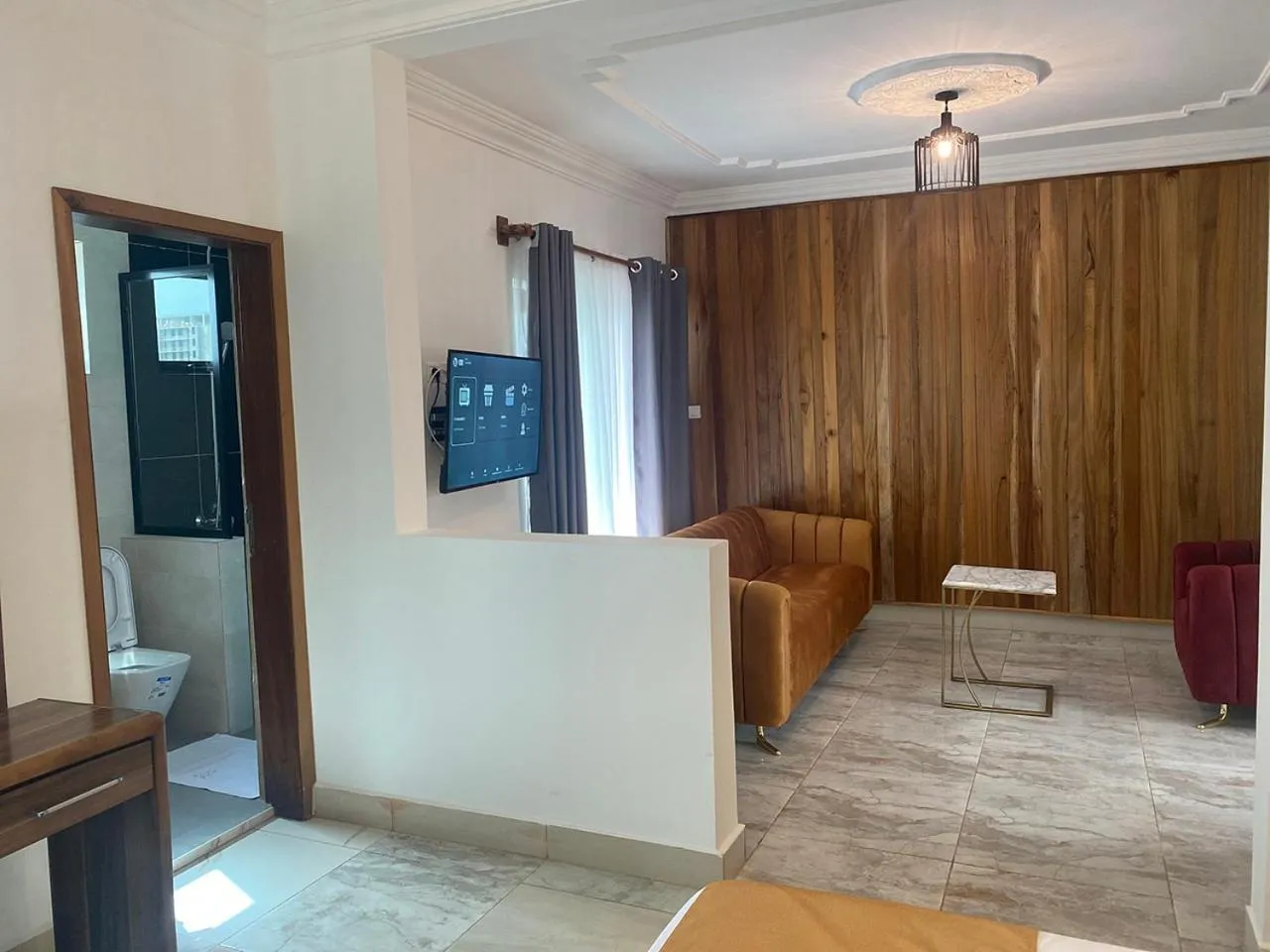 Communal lounge/ TV room in Hotel Residence La Corniche