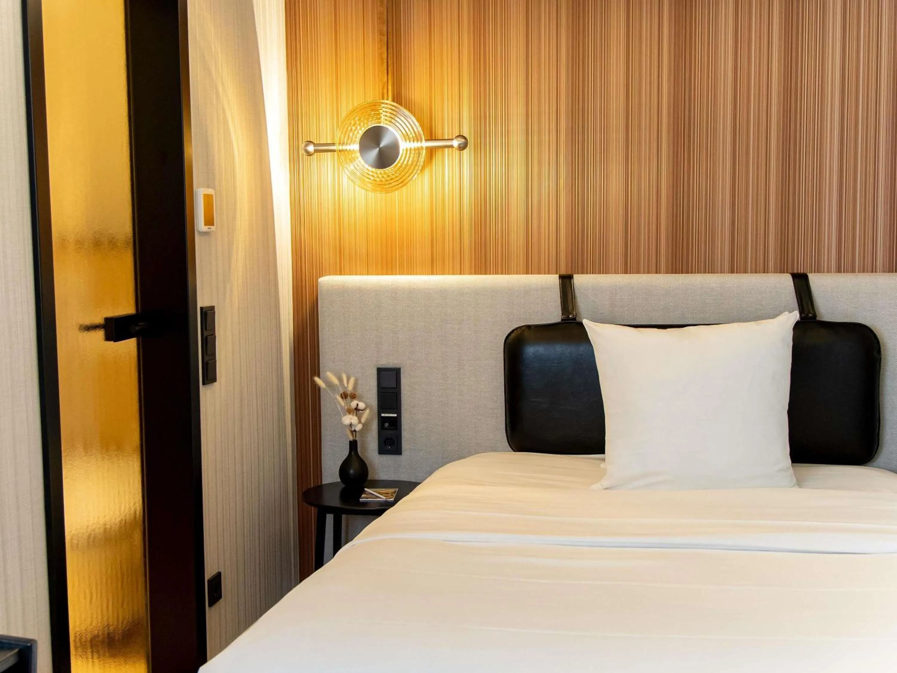 Bedroom, Bed in MUZE Hotel Dusseldorf - Handwritten Collection