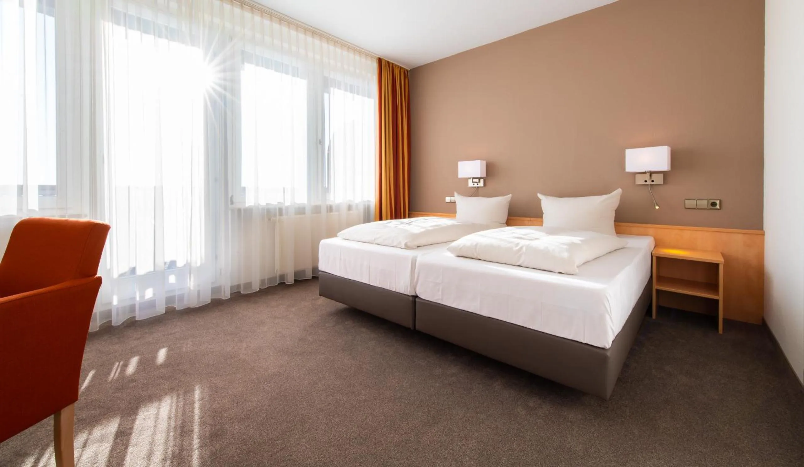 Bed in ARAMIS Tagungs- und Sporthotel