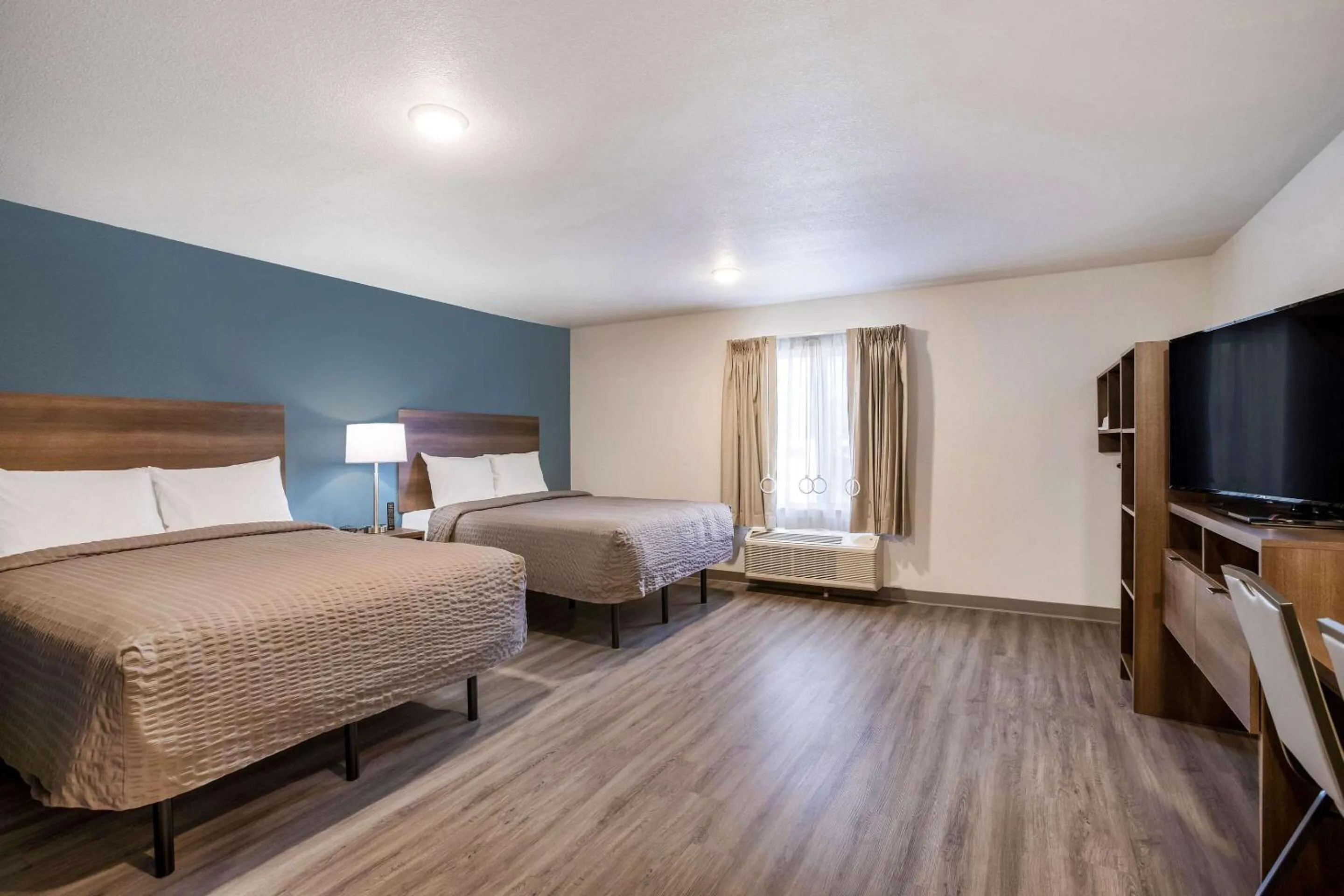 Bed in WoodSpring Suites Detroit Madison Heights