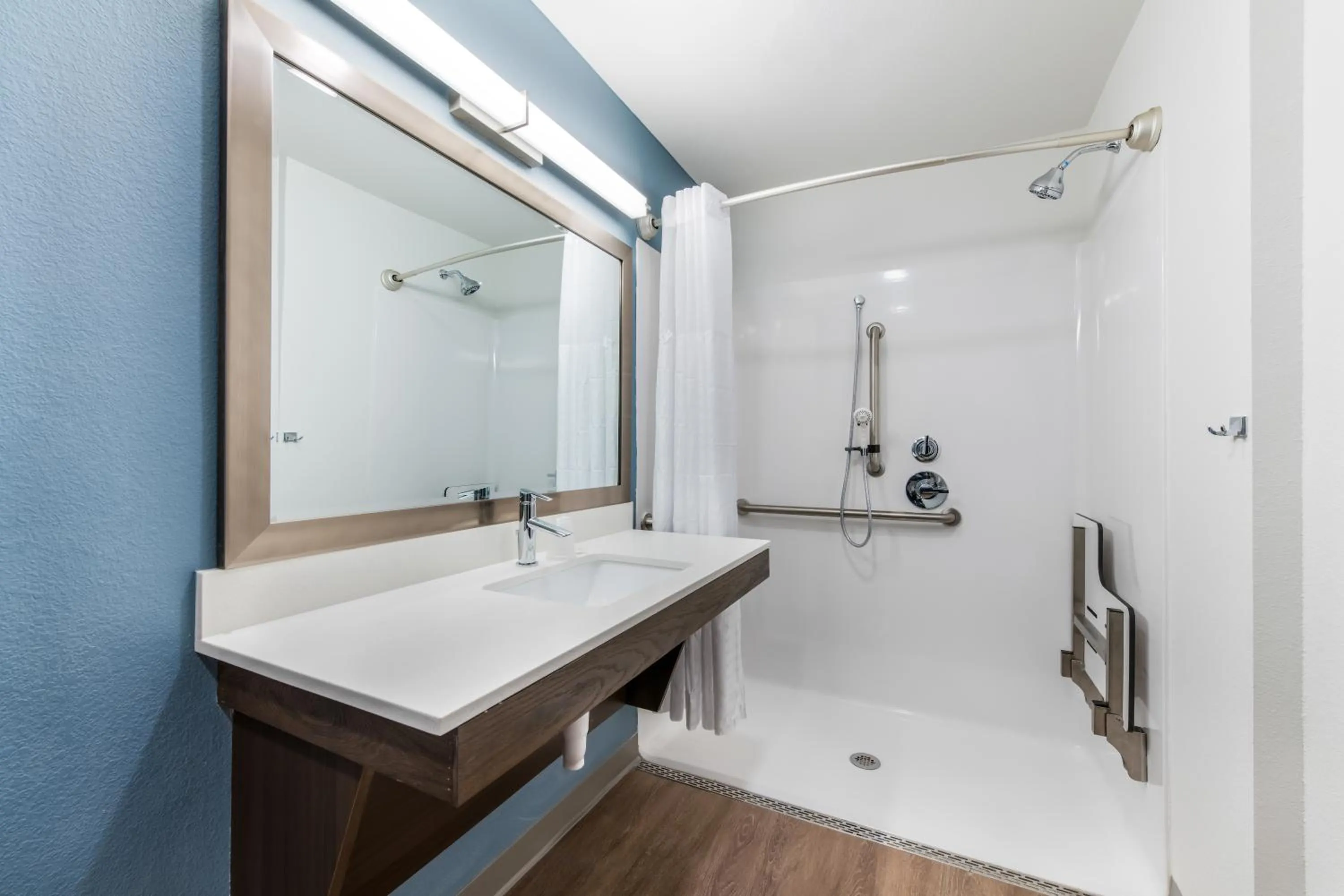 Shower in WoodSpring Suites Charlotte - University Research Park