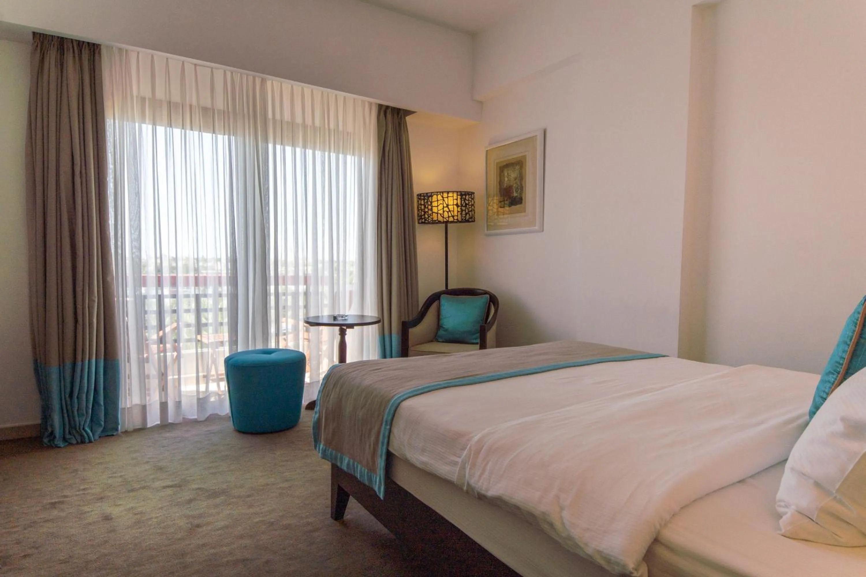 Bed in Arkin Palm Beach Hotel