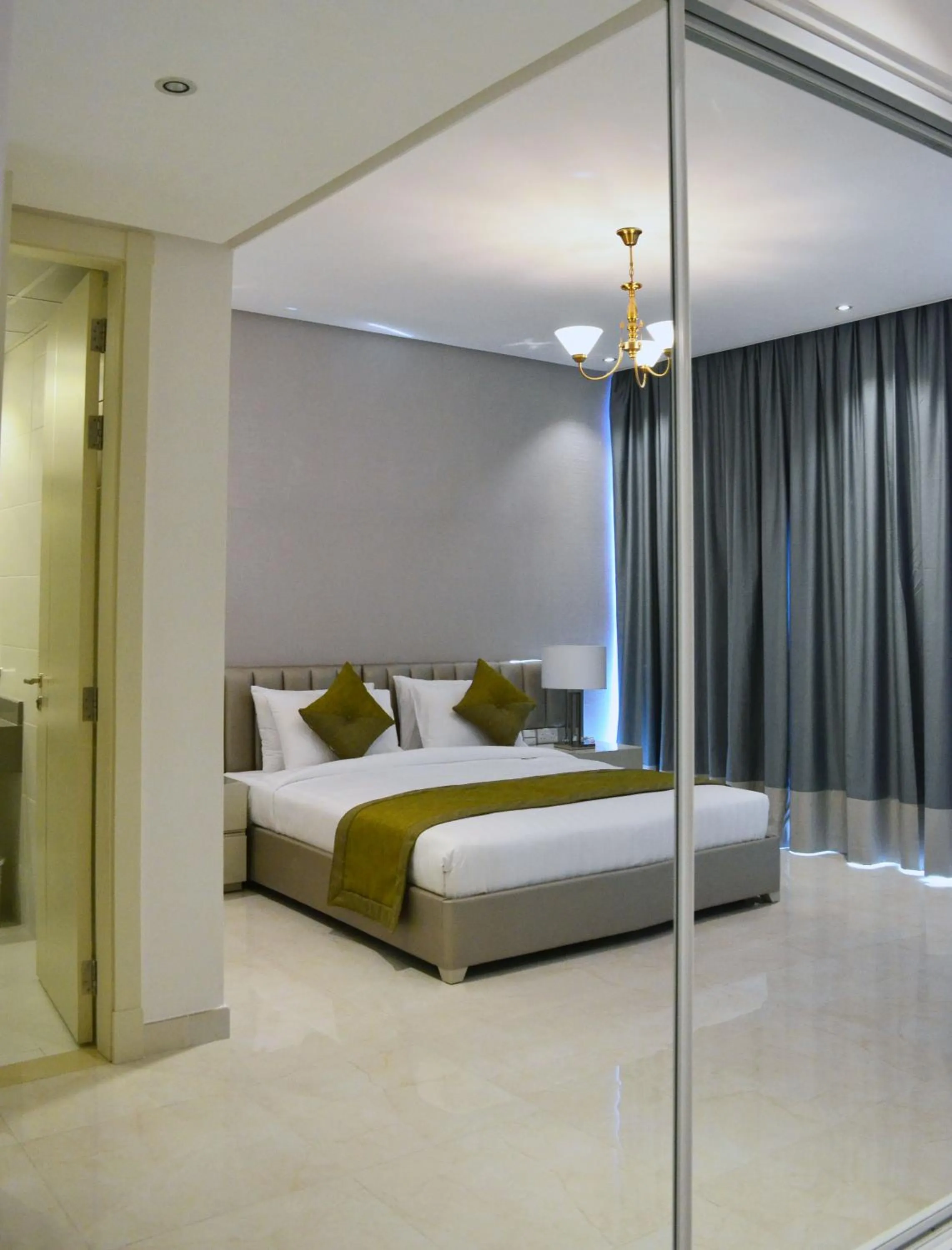 wardrobe, Bed in The Lodge Suites