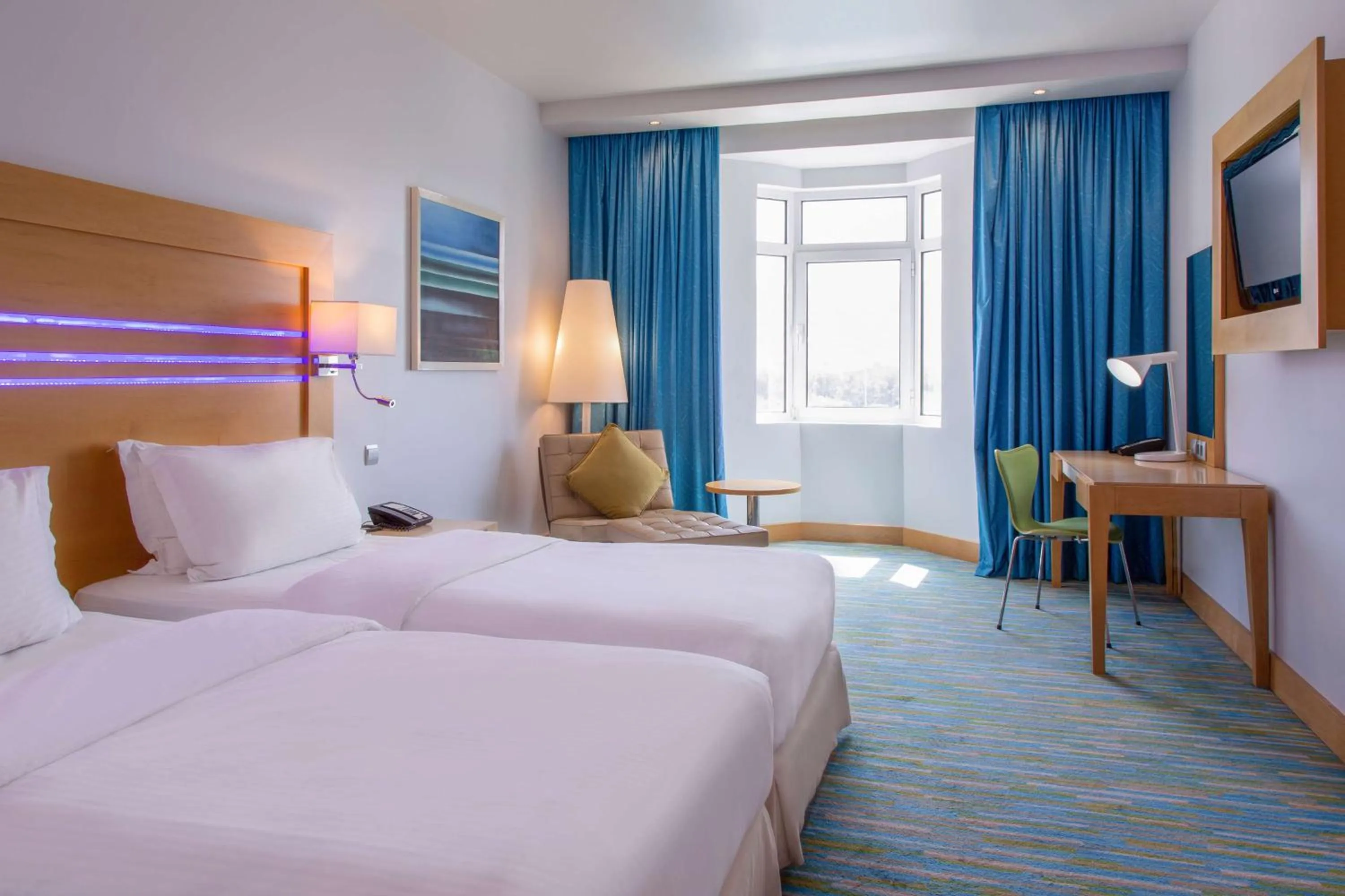 Photo of the whole room, Bed in Radisson Blu Hotel, Muscat