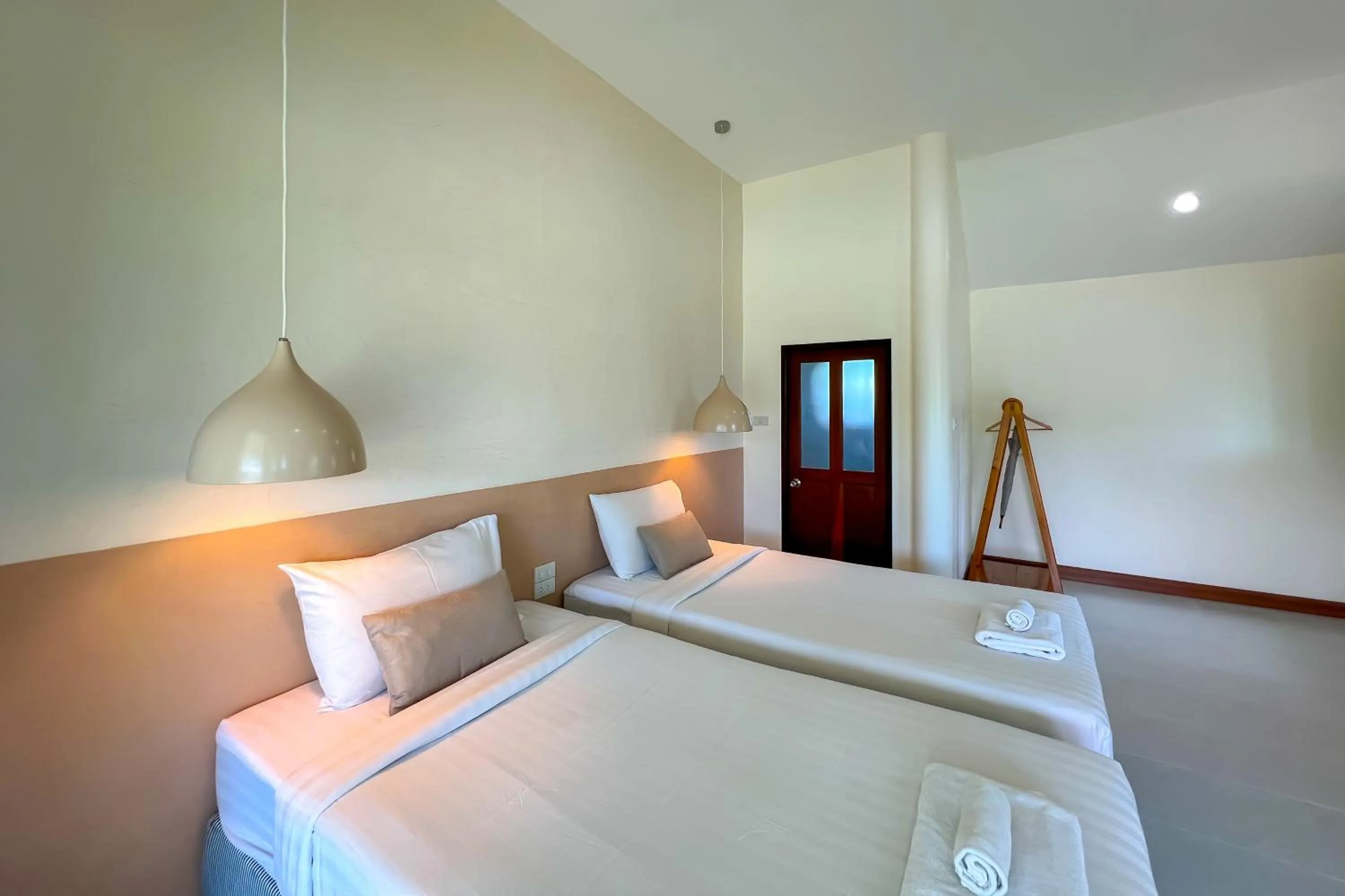 Bed in Nisasiri Boutique Resort