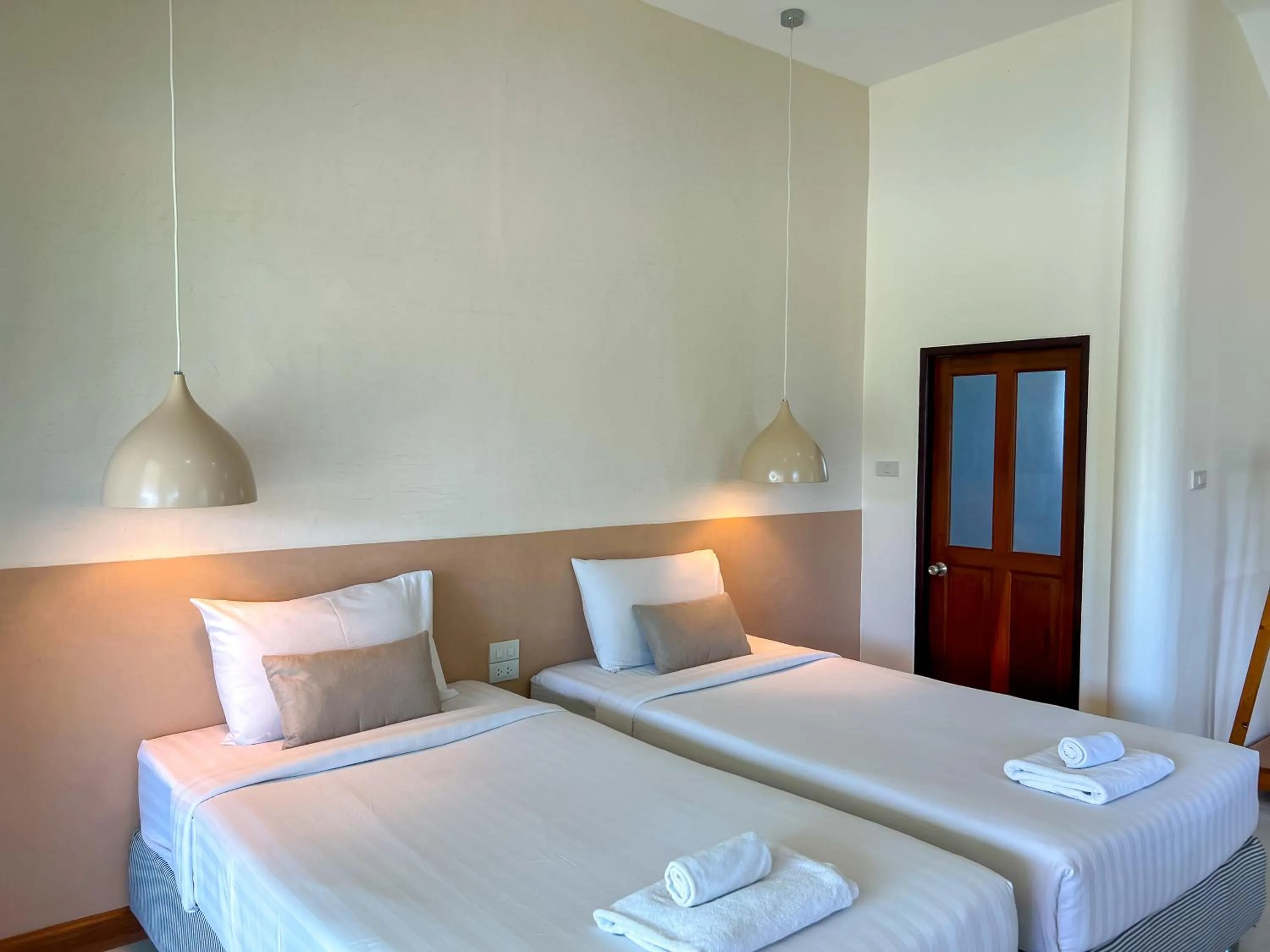 Bed in Nisasiri Boutique Resort