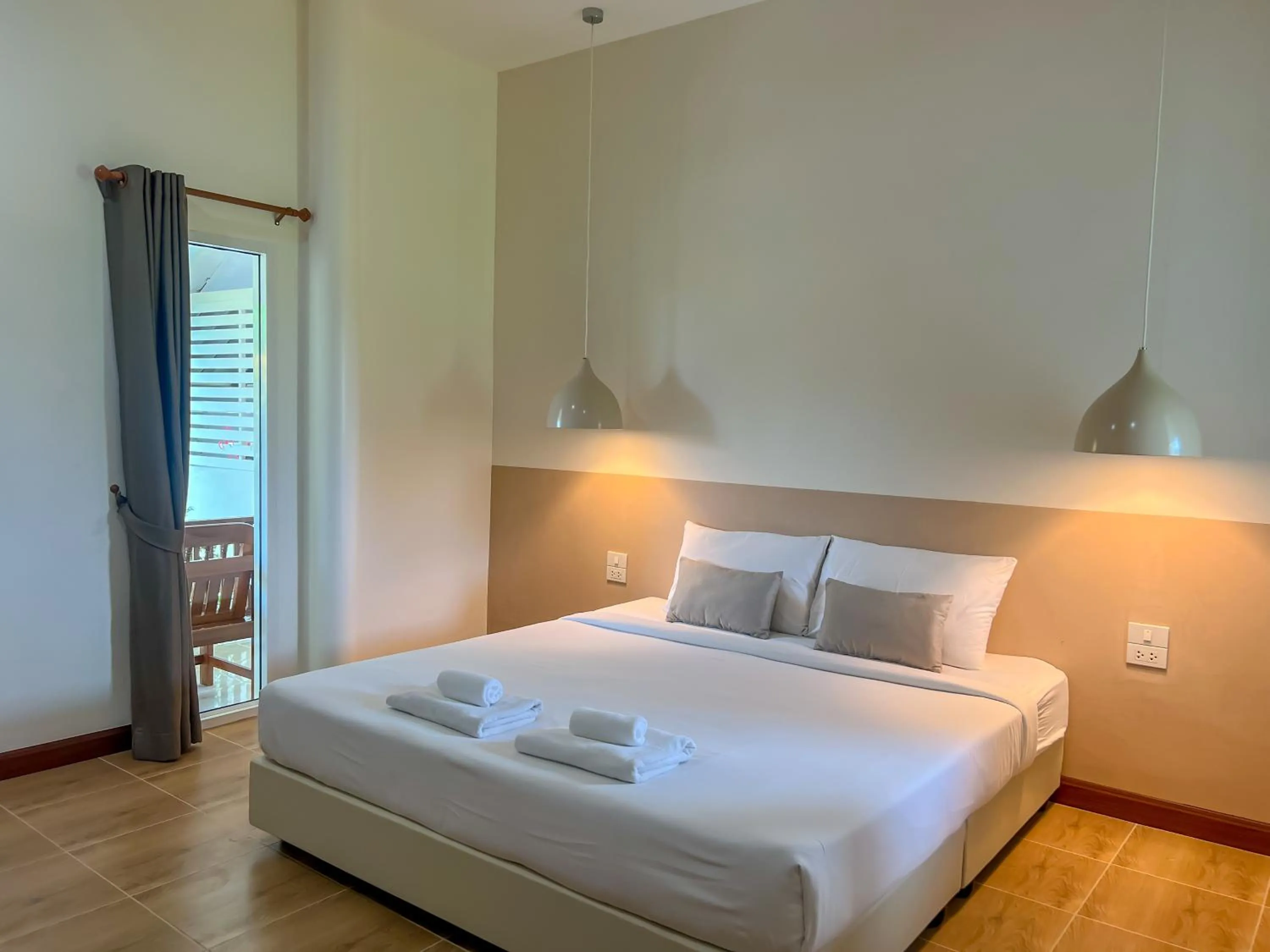 Bed in Nisasiri Boutique Resort