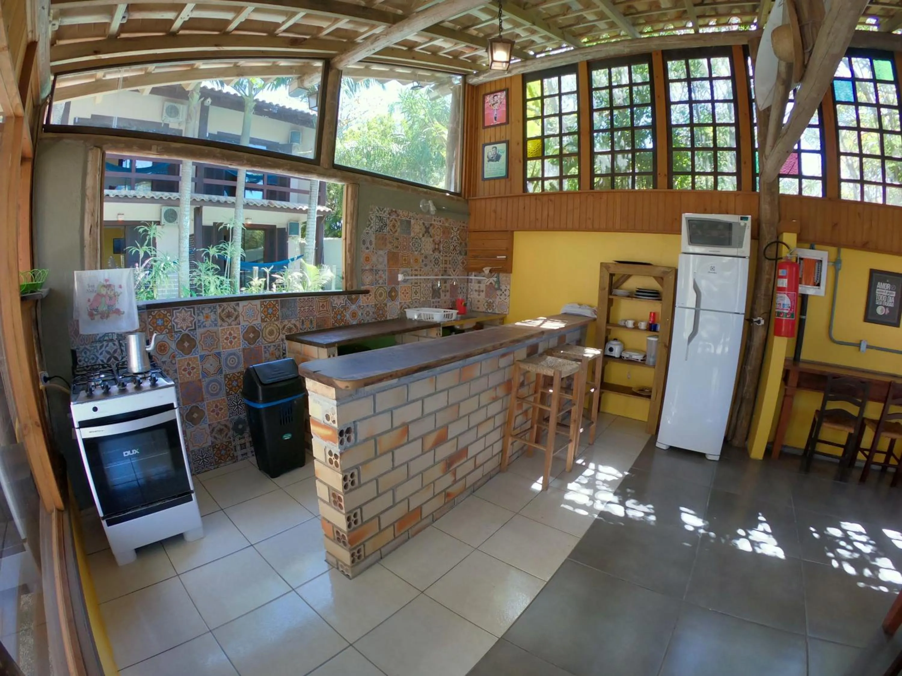 Dining area in Pousada El Pátio da Ferrugem uma quadra da praia