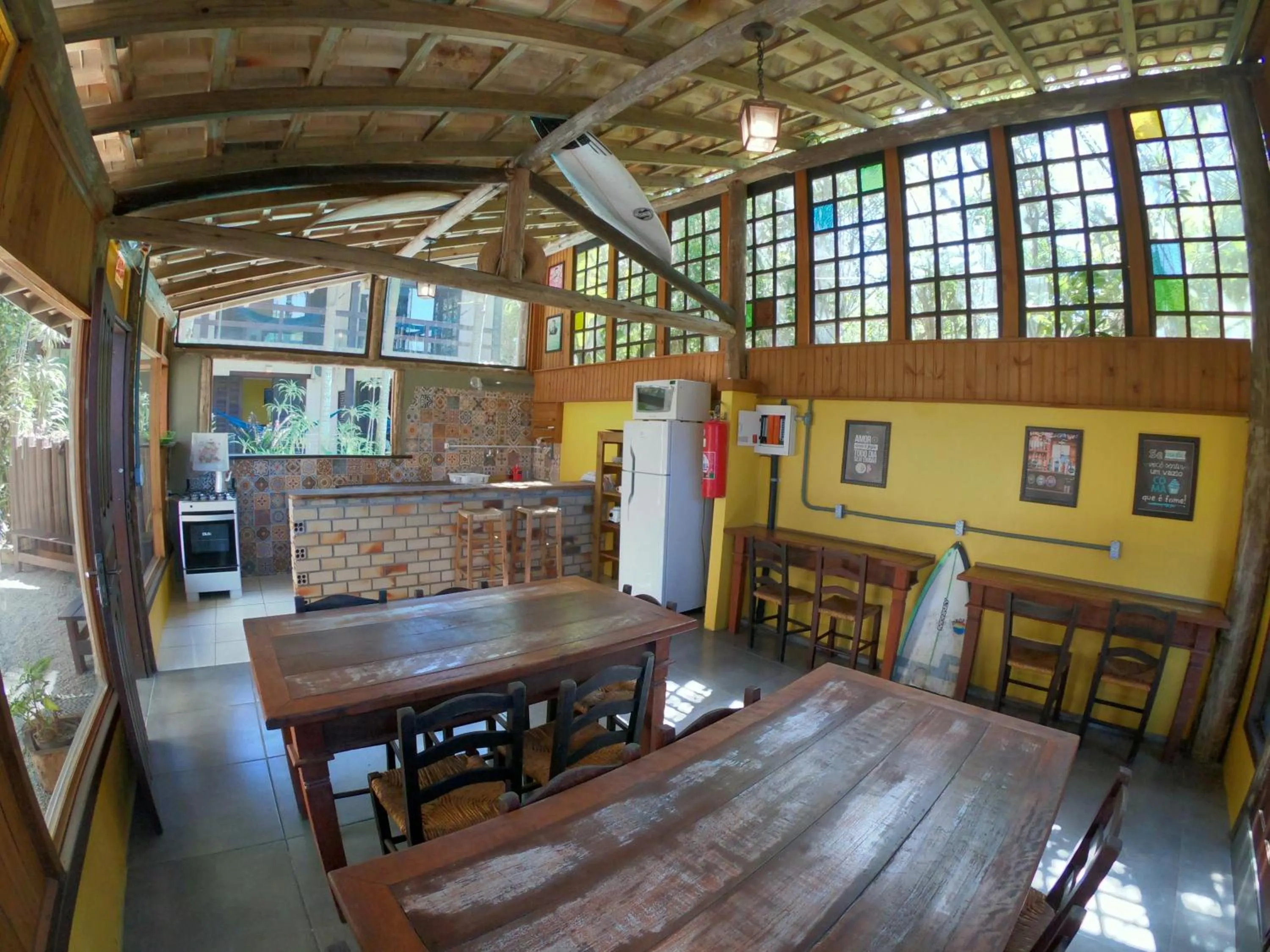 Dining area in Pousada El Pátio da Ferrugem uma quadra da praia