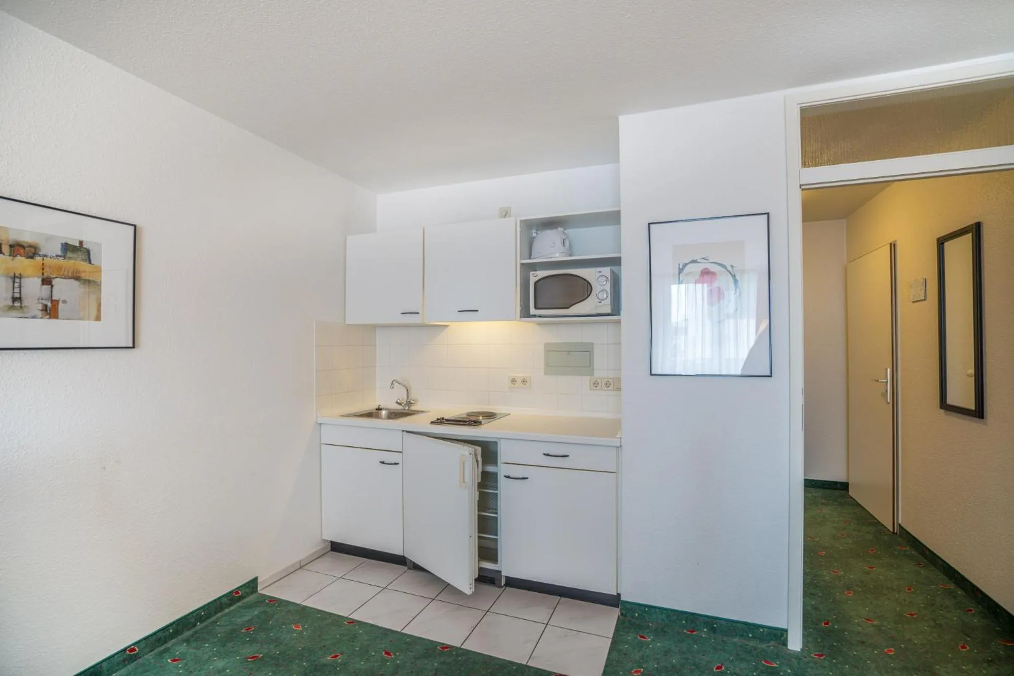 Kitchen or kitchenette in Apartmenthotel Residenz Steinenbronn