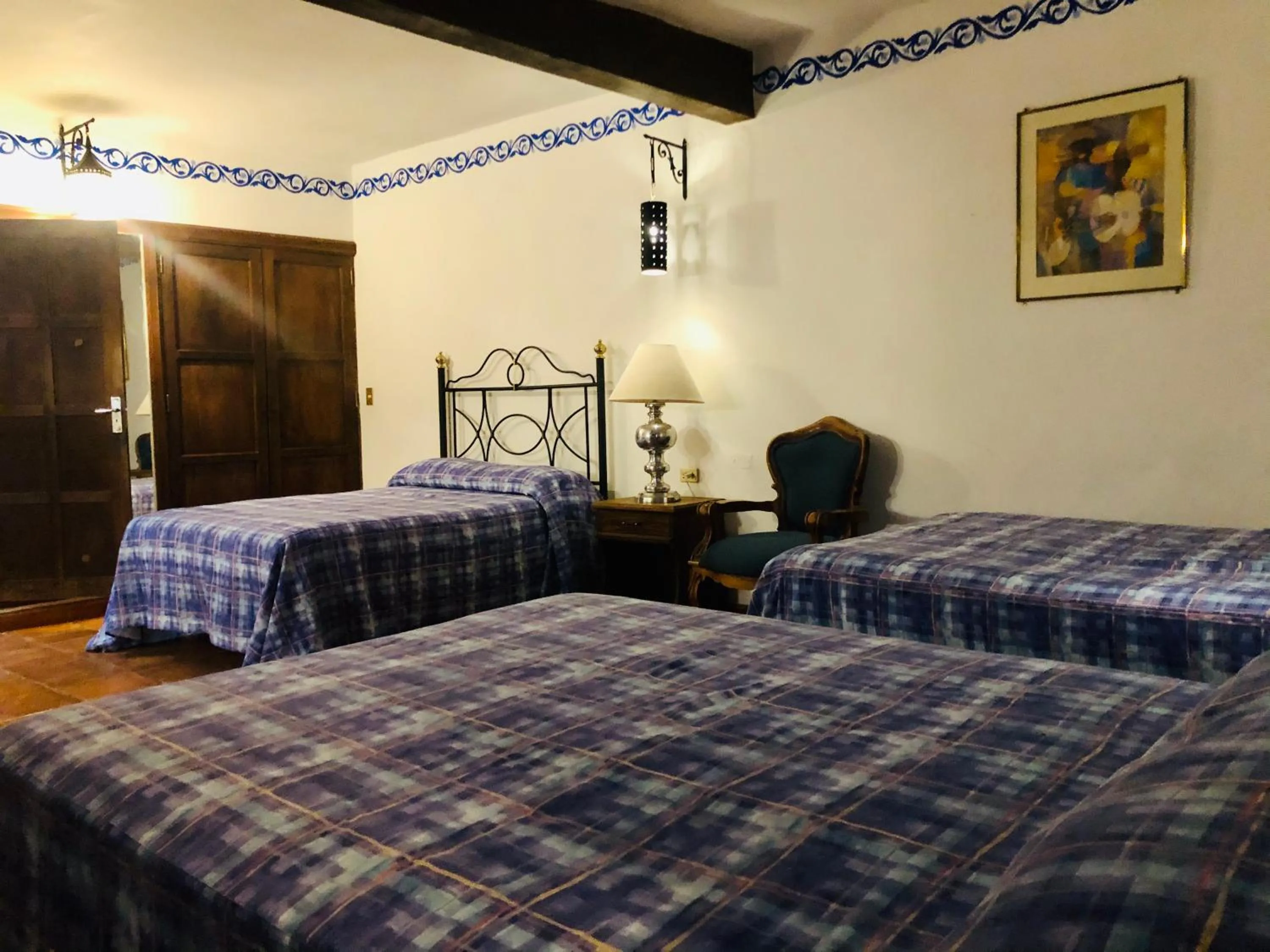 Bed in Hotel Mansión Virreyes by Rotamundos