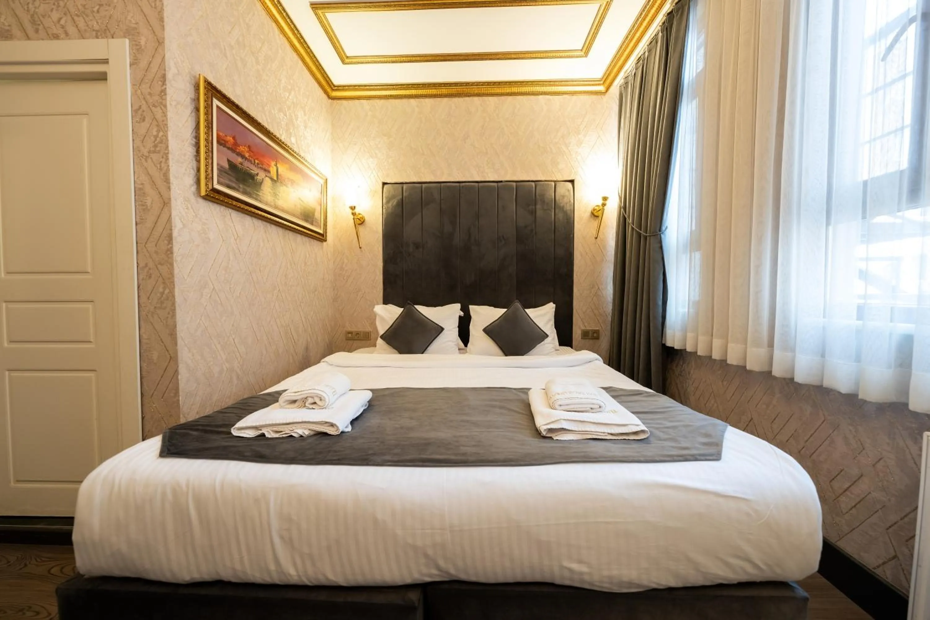 Bed in Diamond Royal Hotel