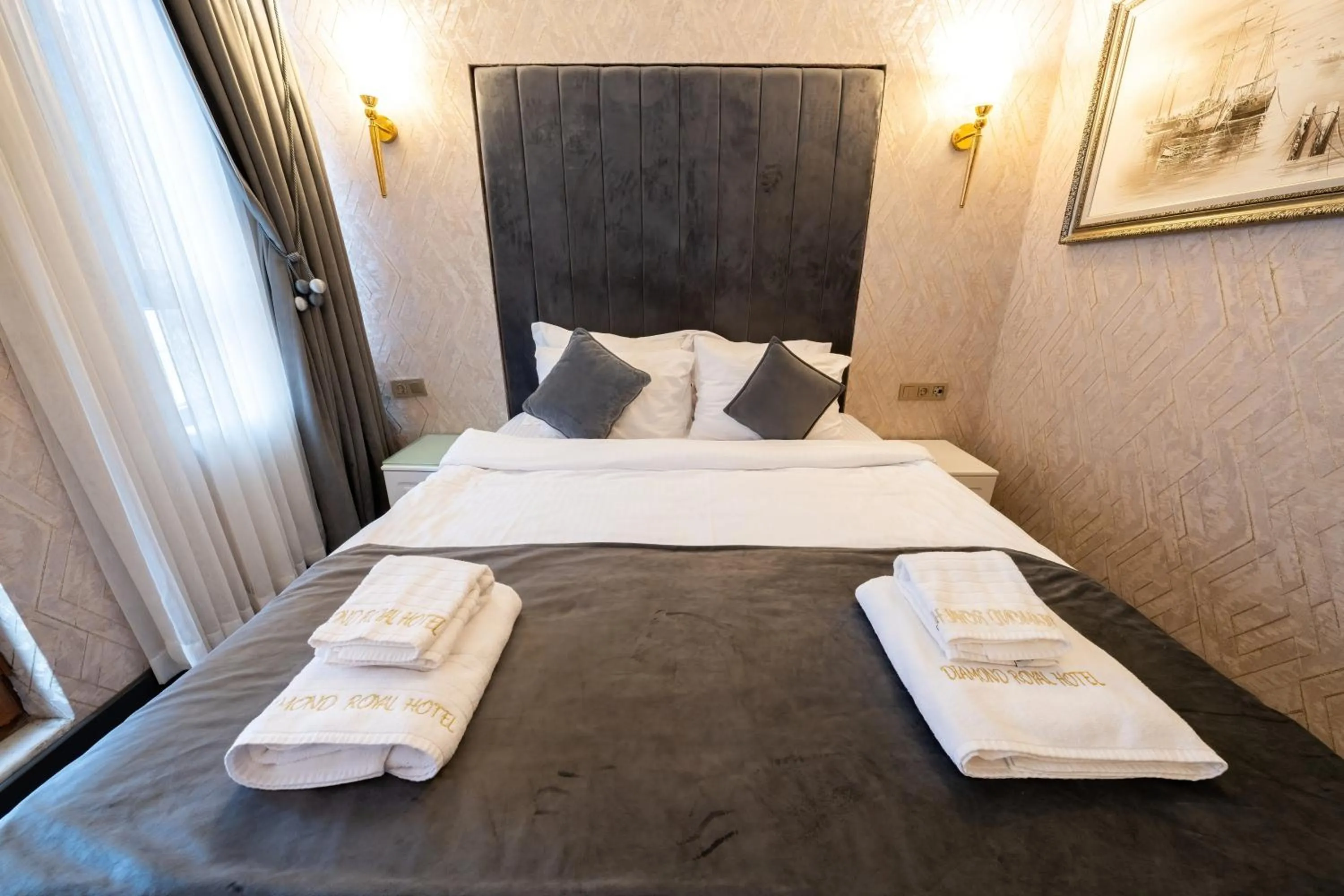 Bed in Diamond Royal Hotel